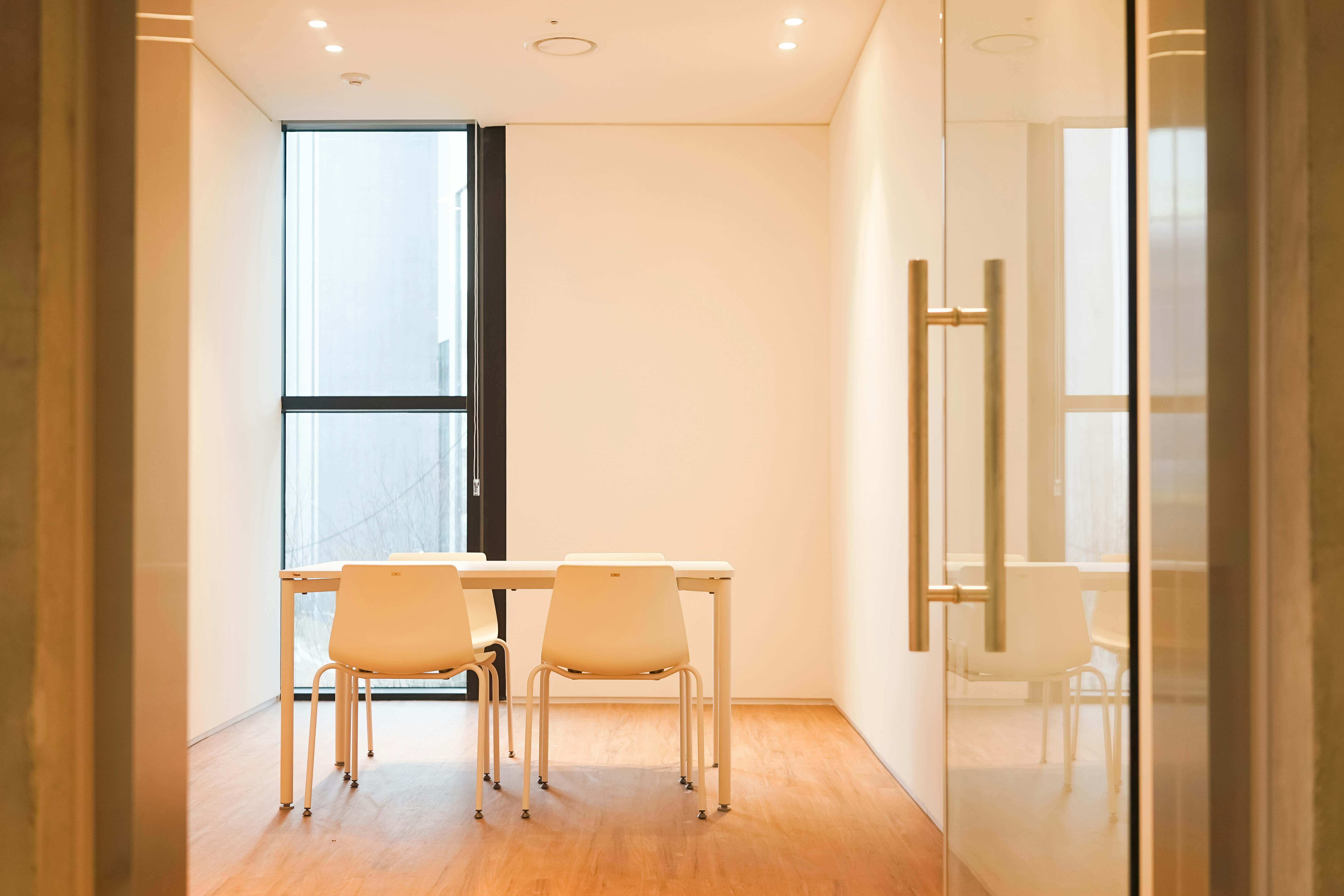 a dining table and chairs in a room