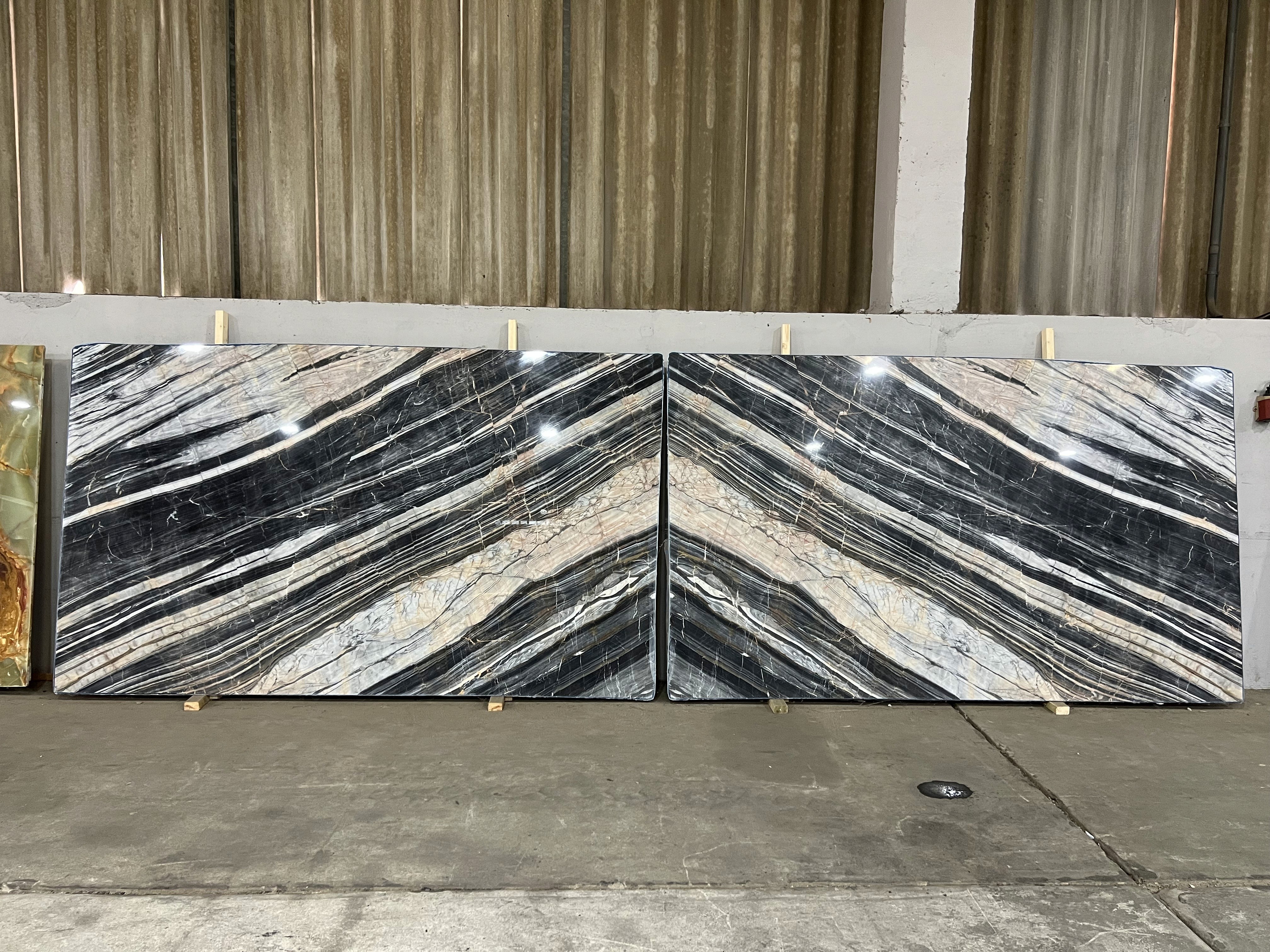 Wavy gray gold marble surface with golden veins