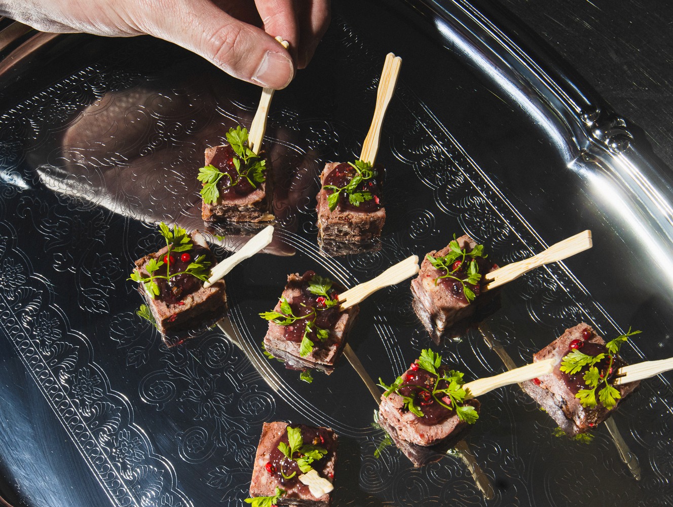 Canape plating with skewers on a silver platter at a Curtis Stone Events dinner, Melbourne