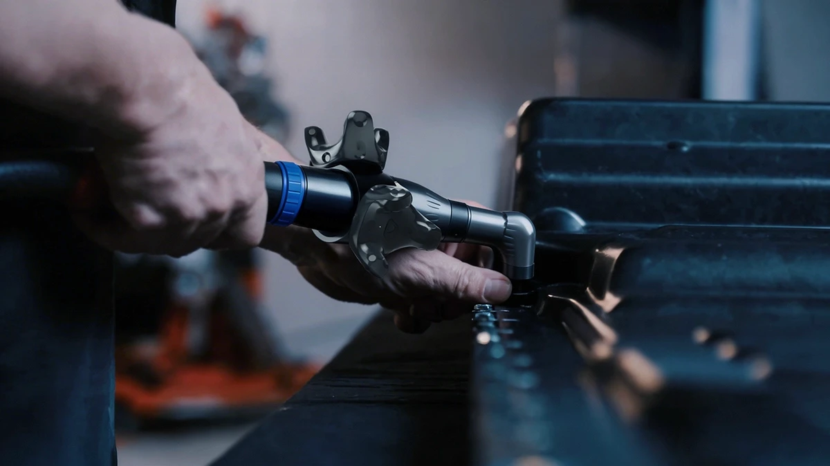 Person using the ToolTrackAR product on a machine