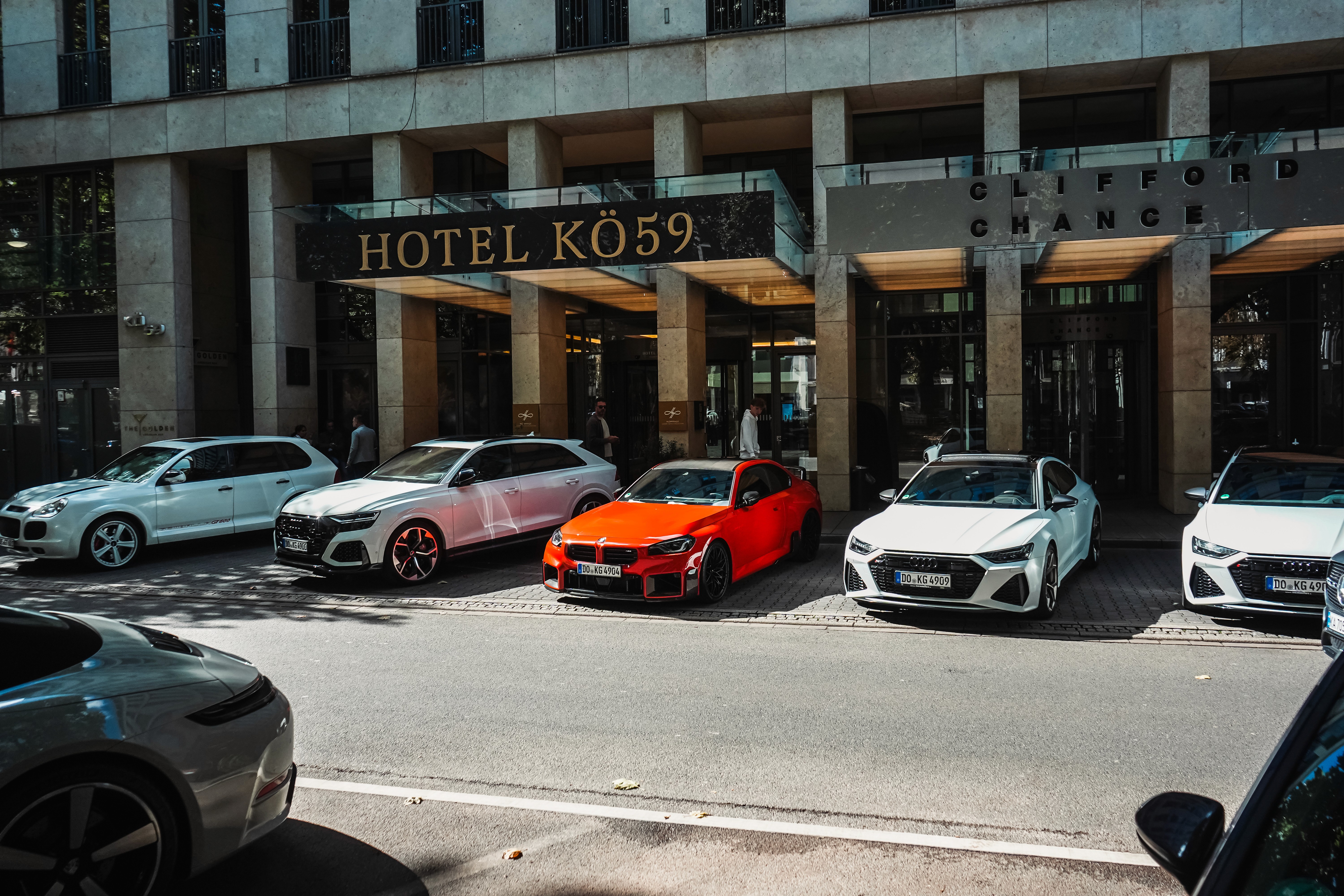 Interior of a car featuring sleek, modern seats, illuminated in a dark setting, emphasizing design and luxury.