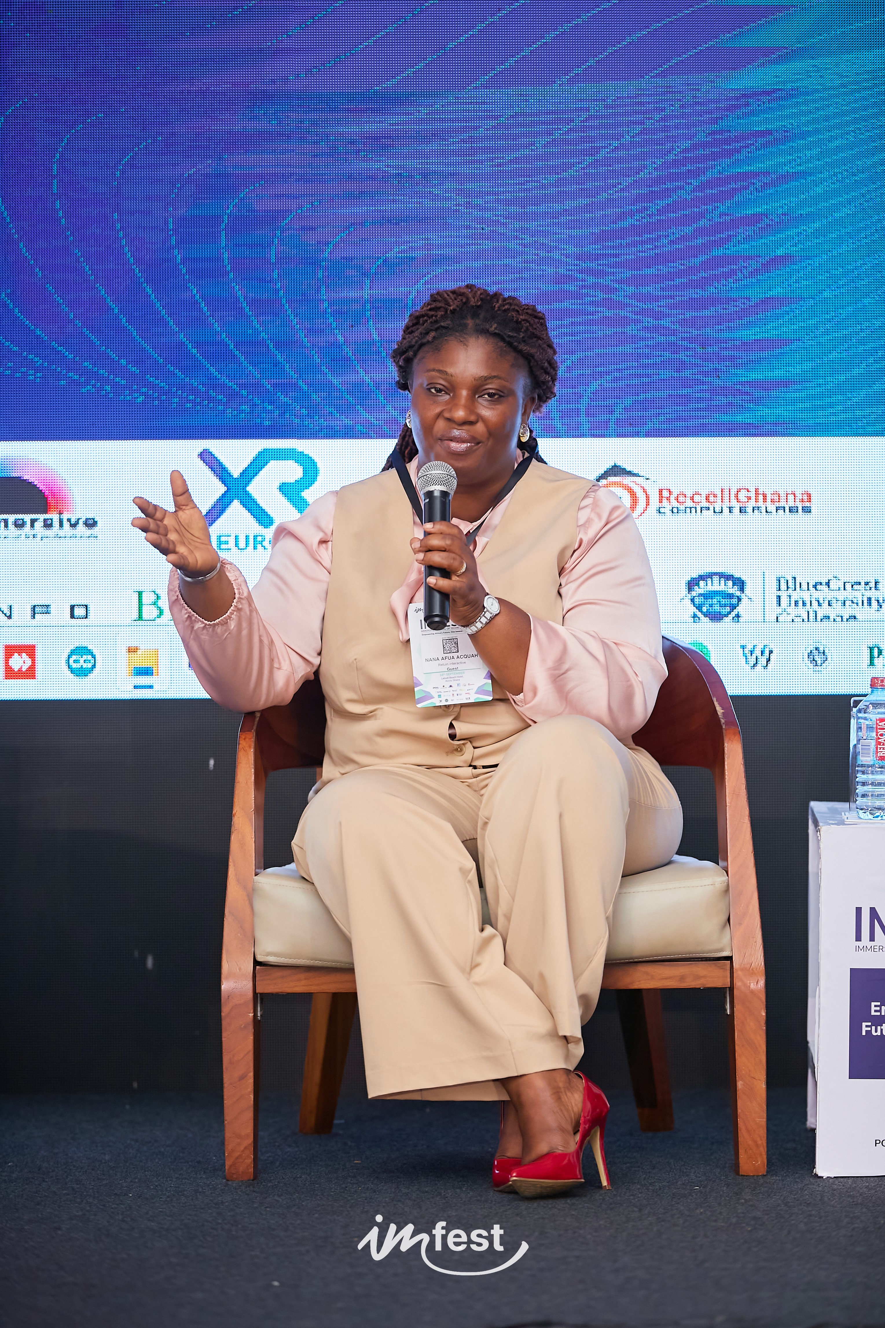 An orange cube-shaped side table is shown.