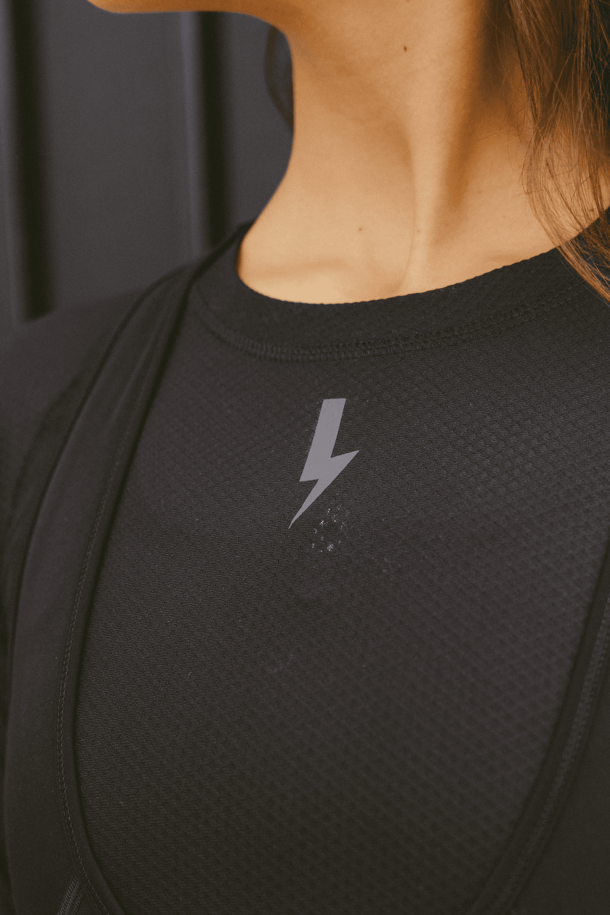 A-close-up-shot-of-the-neckline-and-chest-area-of-a-black-long-sleeve-base-layer-top