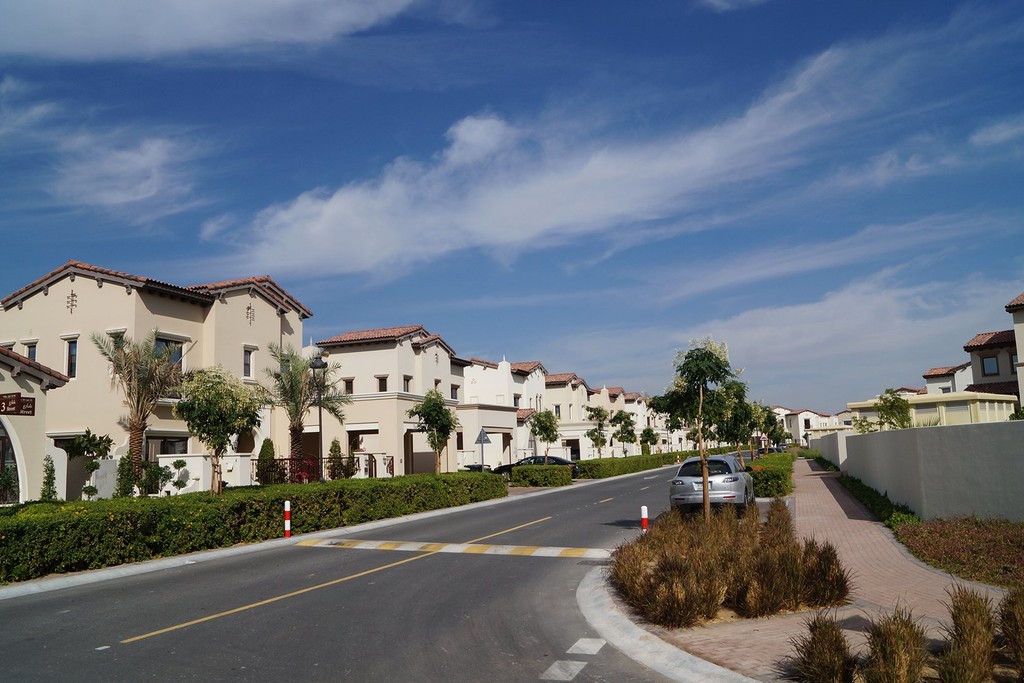 Scenic landscape of Arabian Ranches 2, featuring elegant homes, landscaped gardens, and tranquil streets in a residential area.