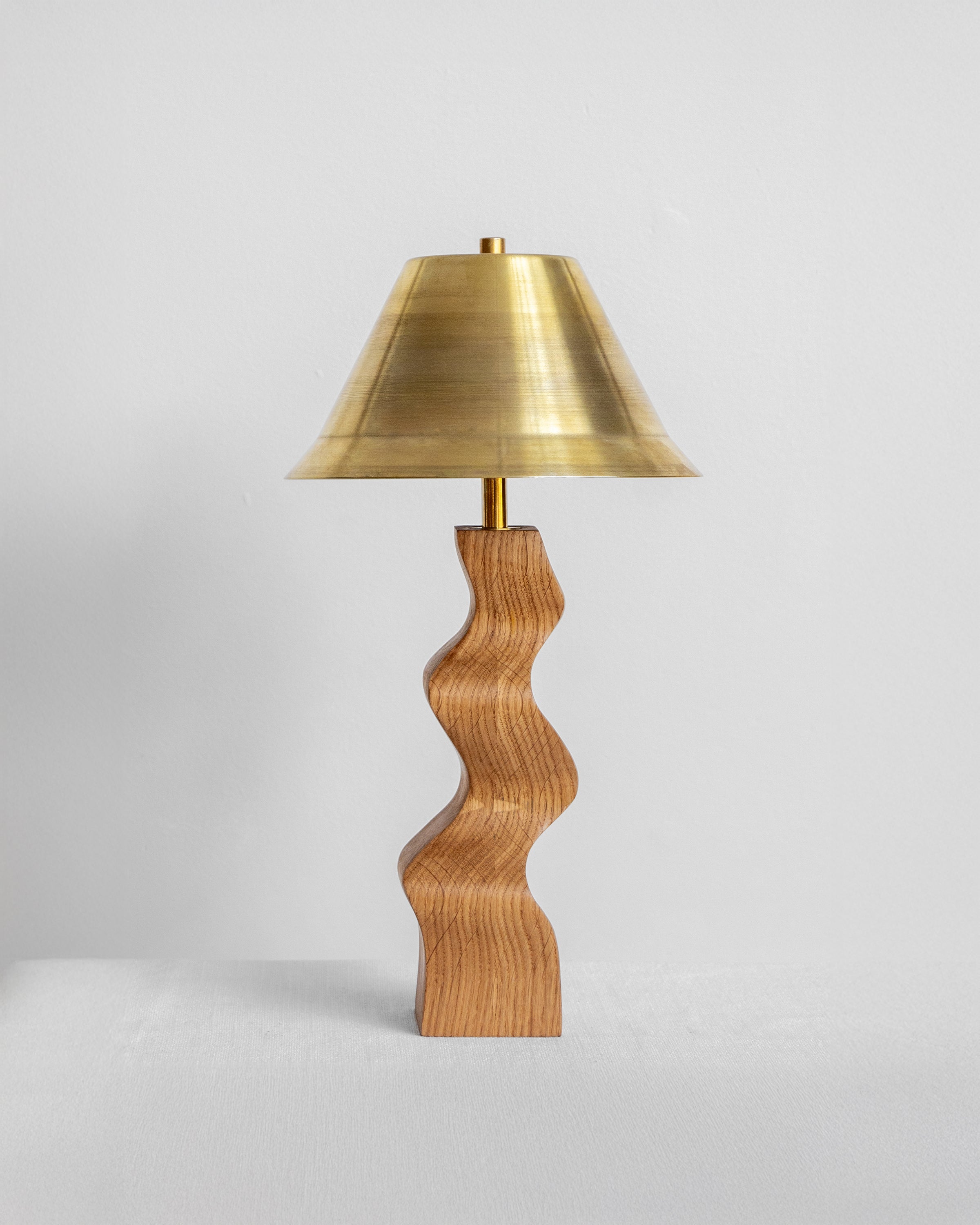 Rippled Desk Lamp in Oak with Brass Shade with UK, EU and US/CA wiring available on white background Wilkinson & Rivera