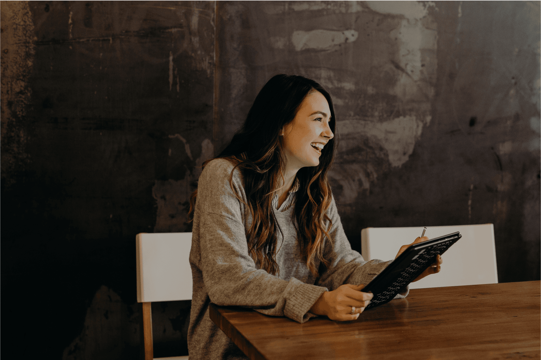 A woman smiles, similarly to leadership and resilience participants
