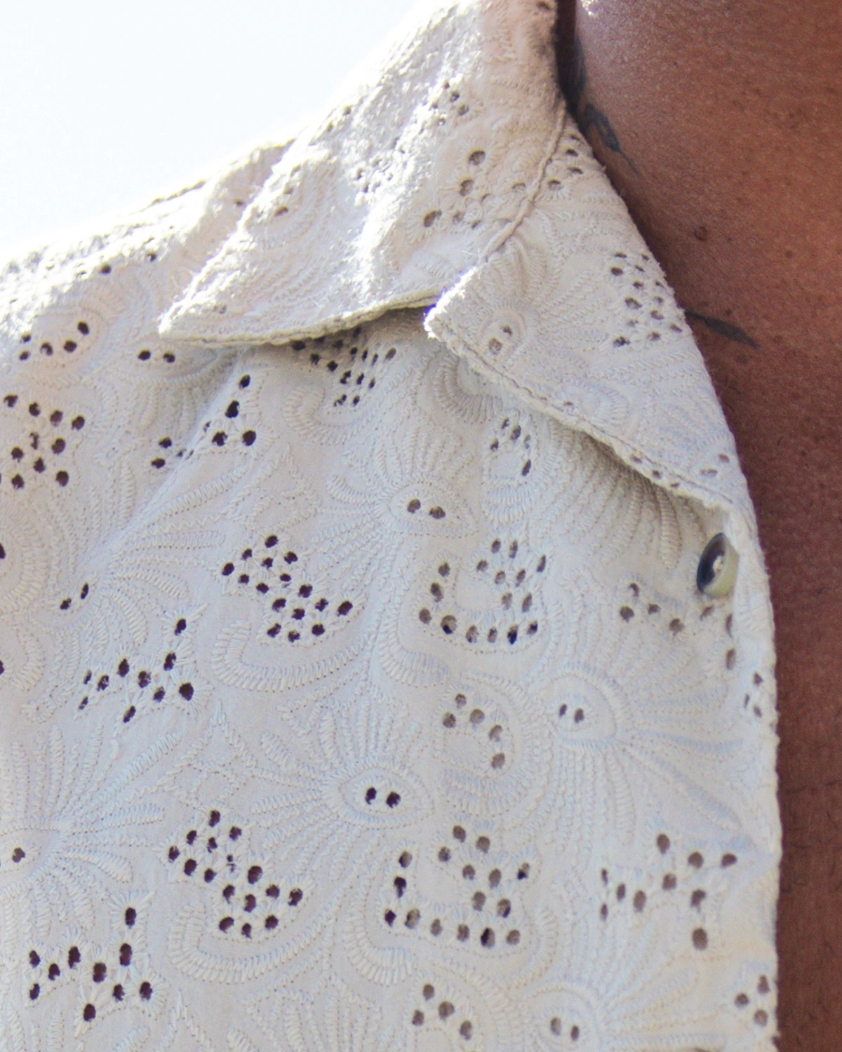 two womans wearing white jackets using the hood