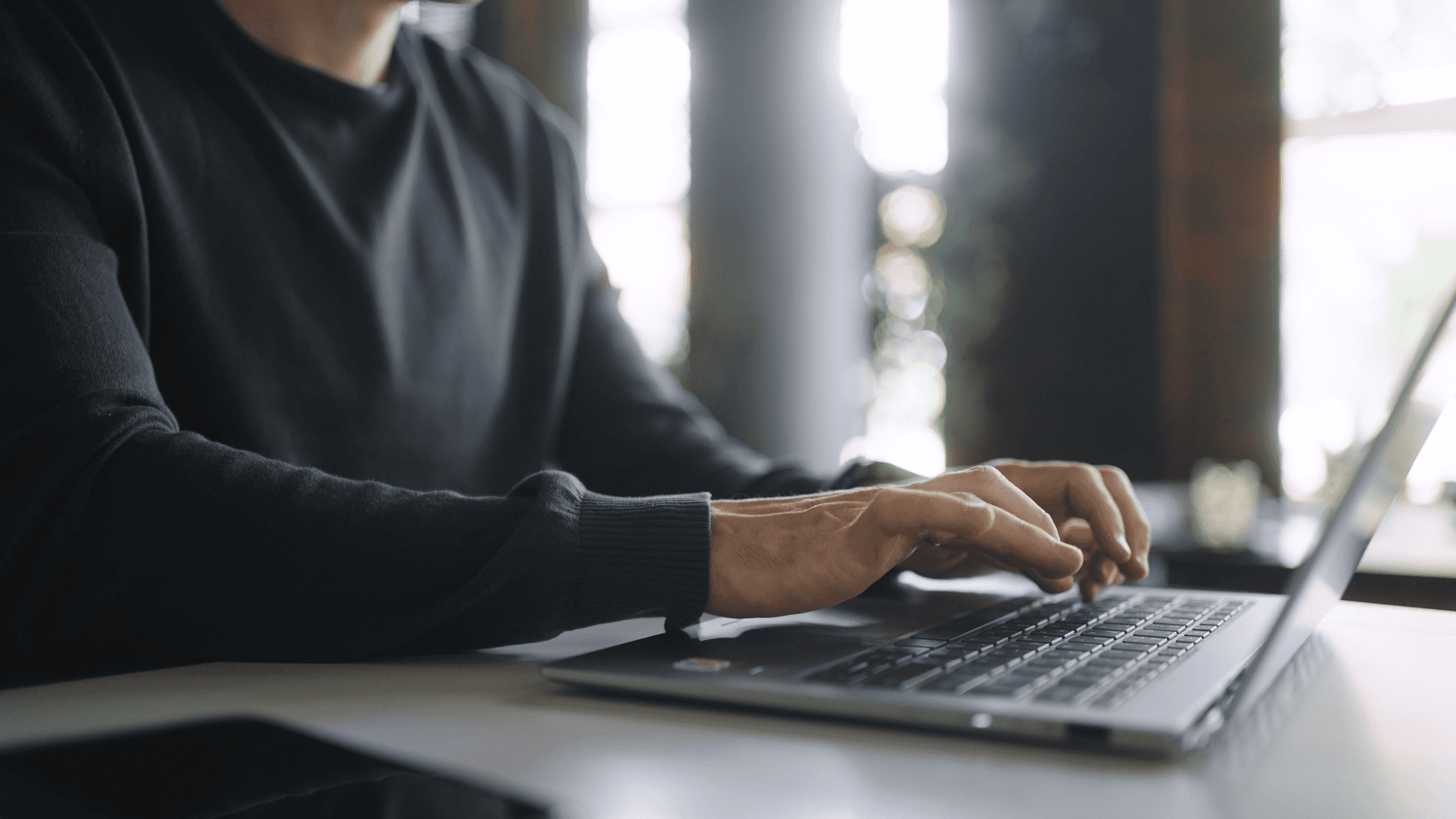 A man using his laptop.