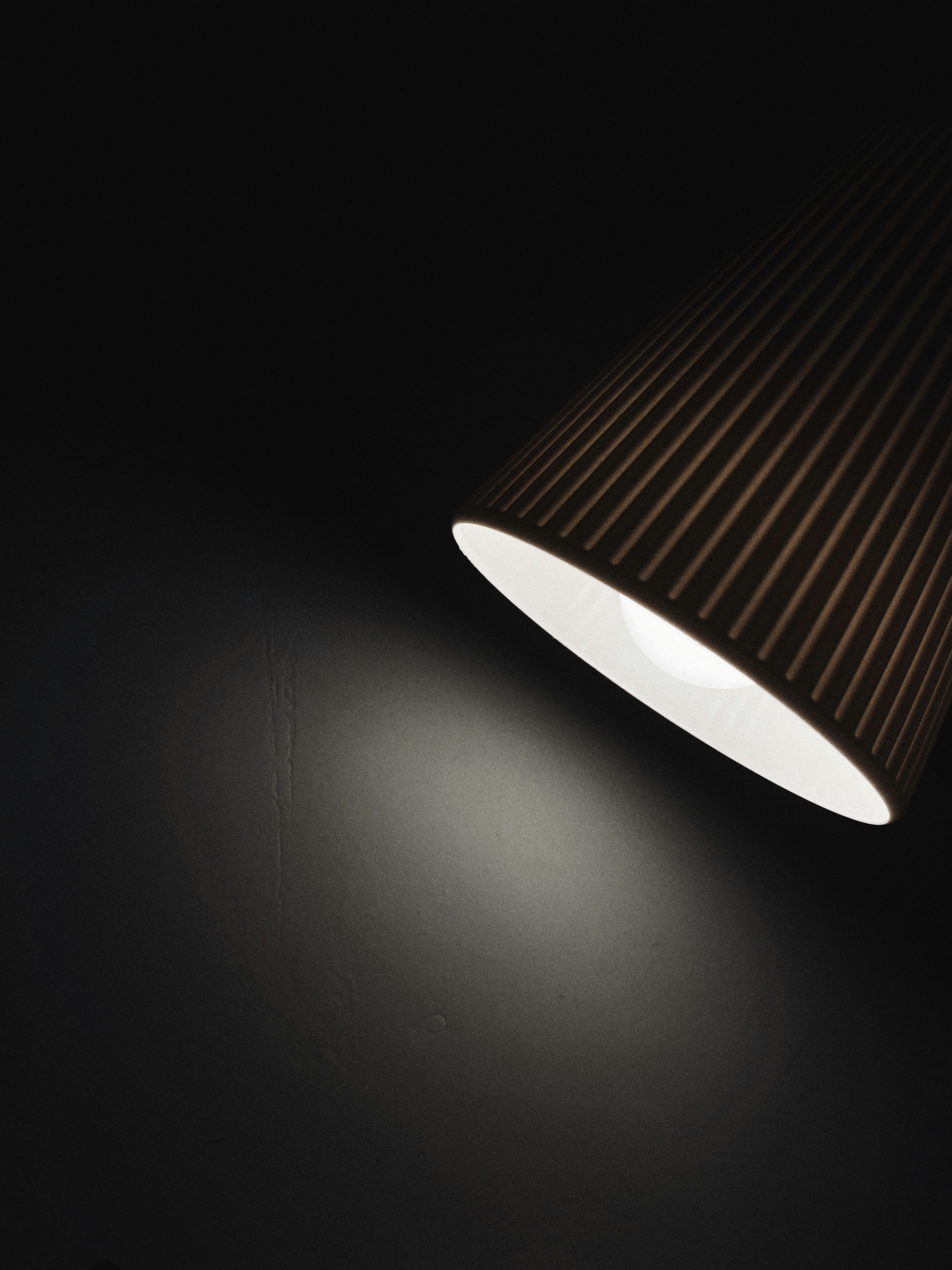 white pendant lamp turned on in dim lit room