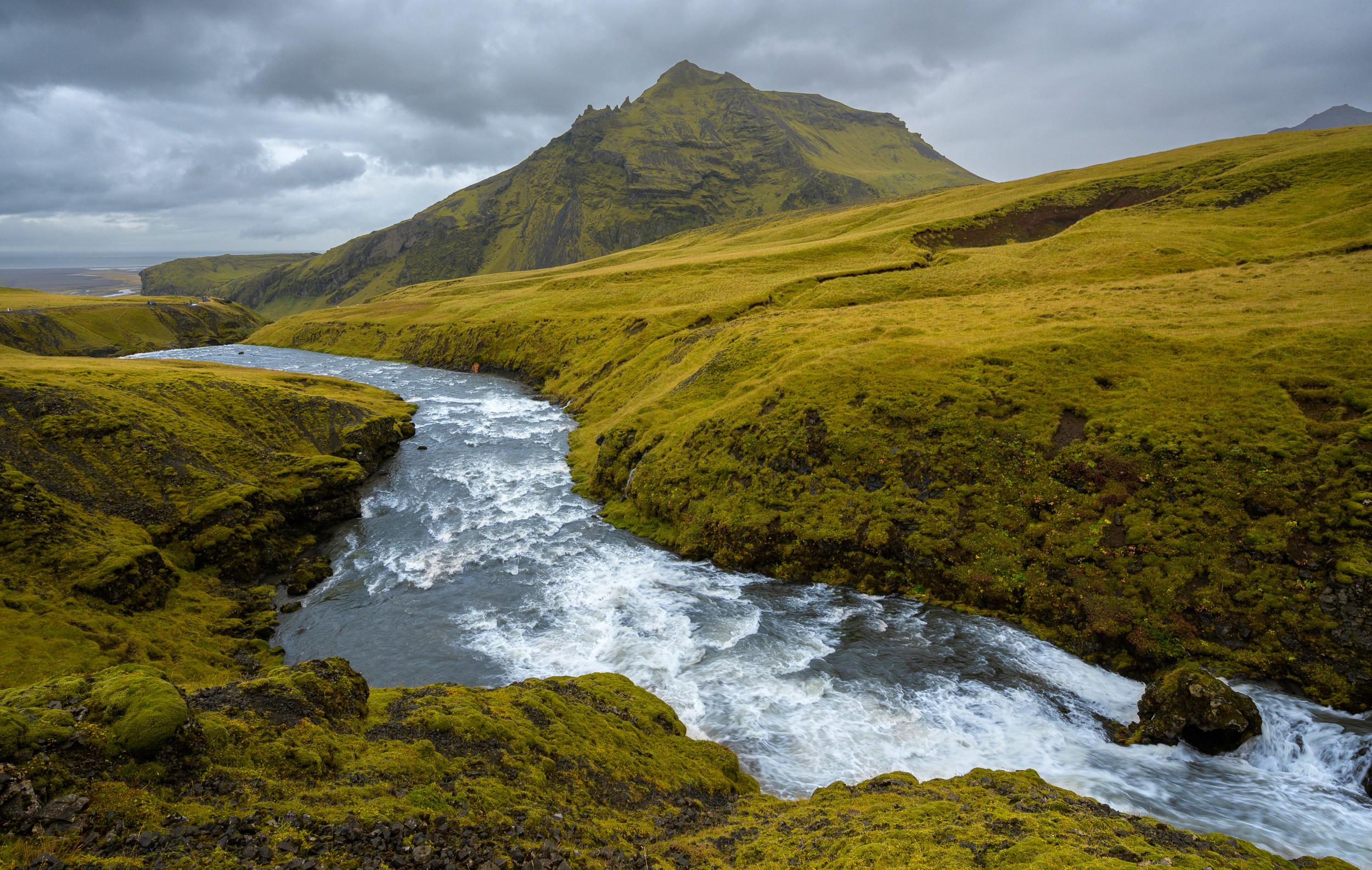 The rivers wind above the powerful Skogafoss waterfall, Iceland