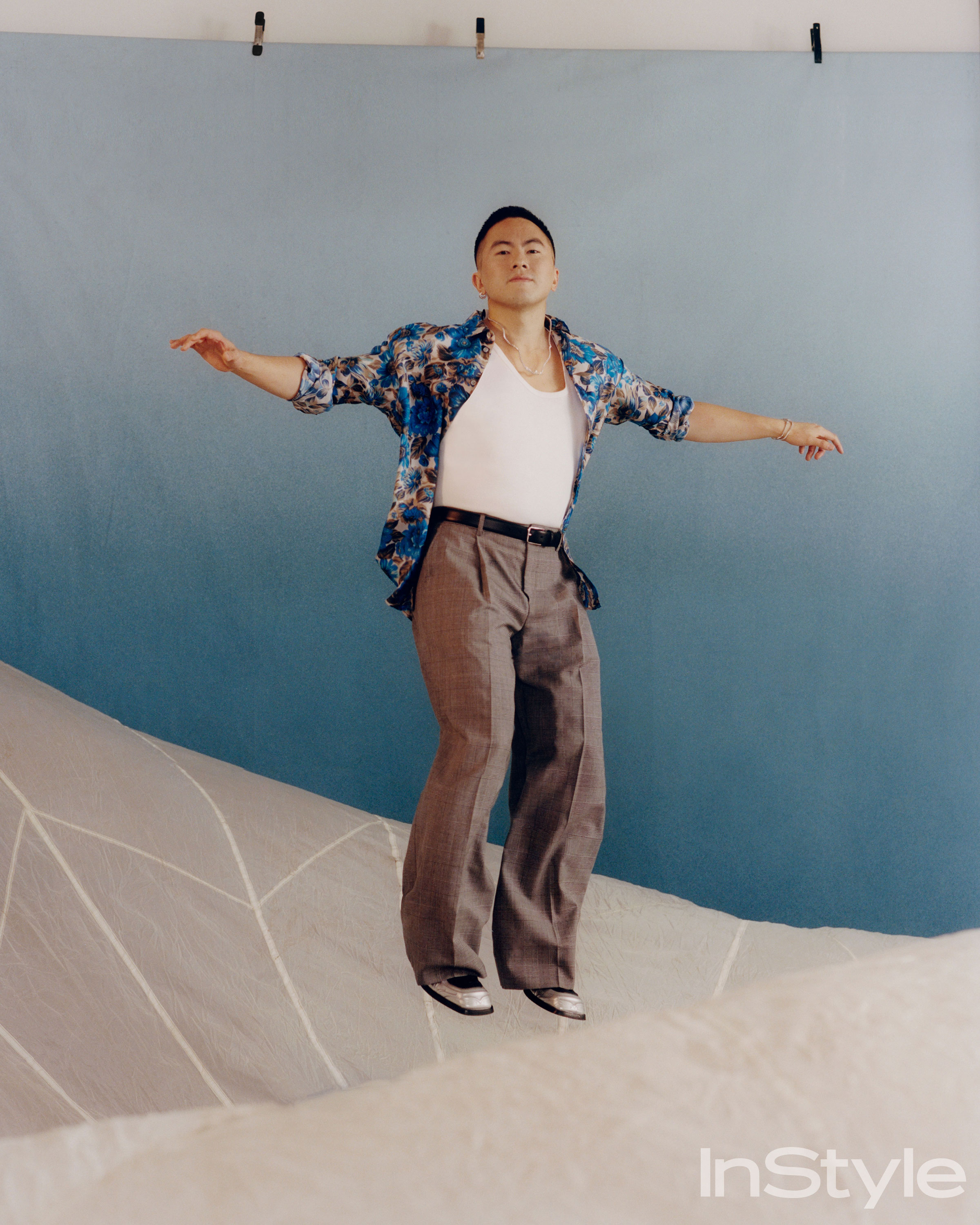 Bowen Yang floating above clouds for InStyle