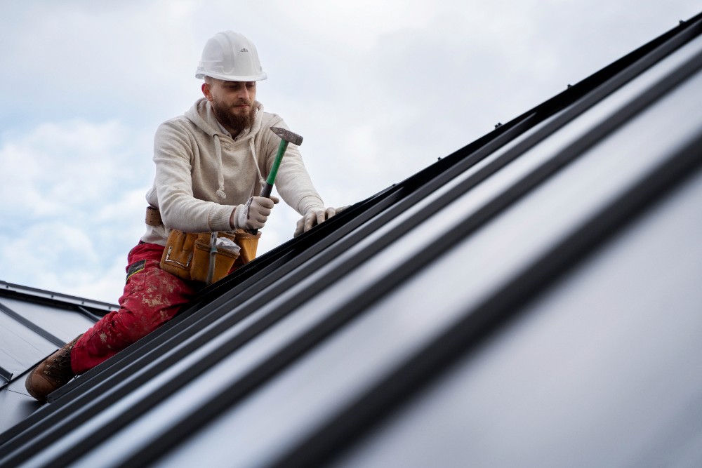 Construction worker making progress on customer roof project