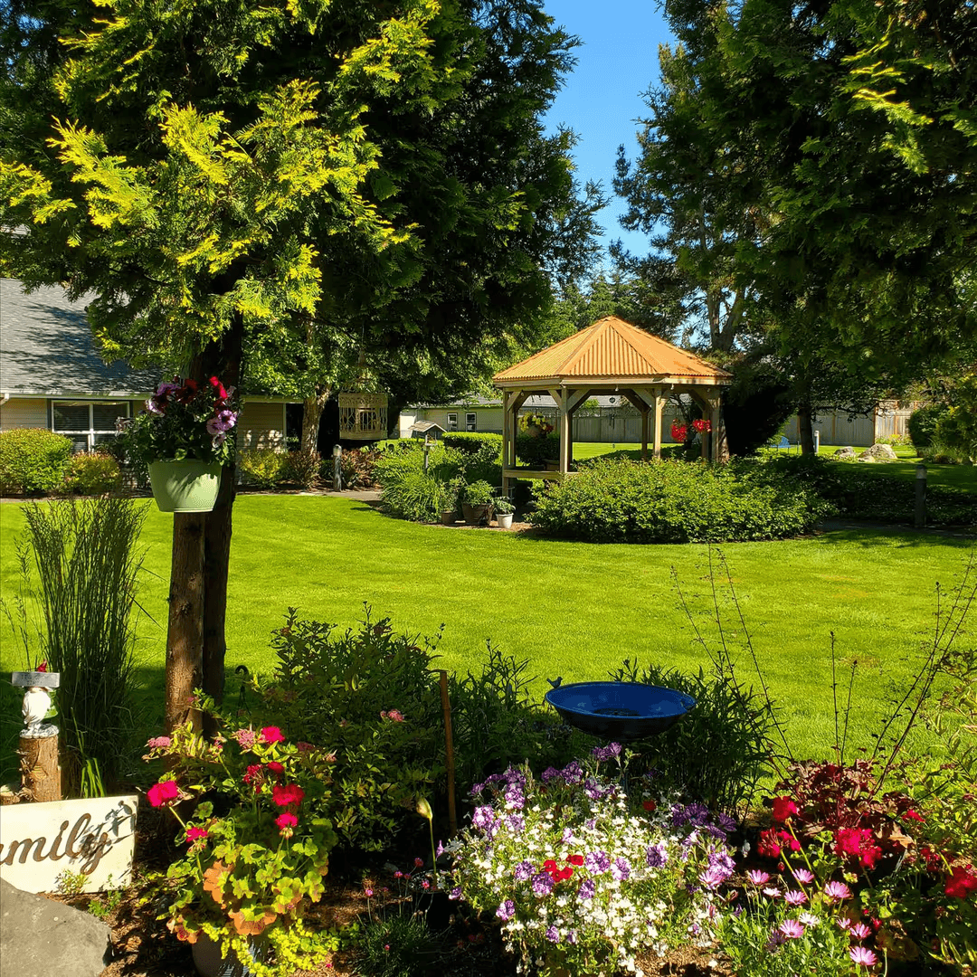 Secure outdoor gazebo and garden area in an assisted living community with memory care, offering safe fresh-air space for residents.