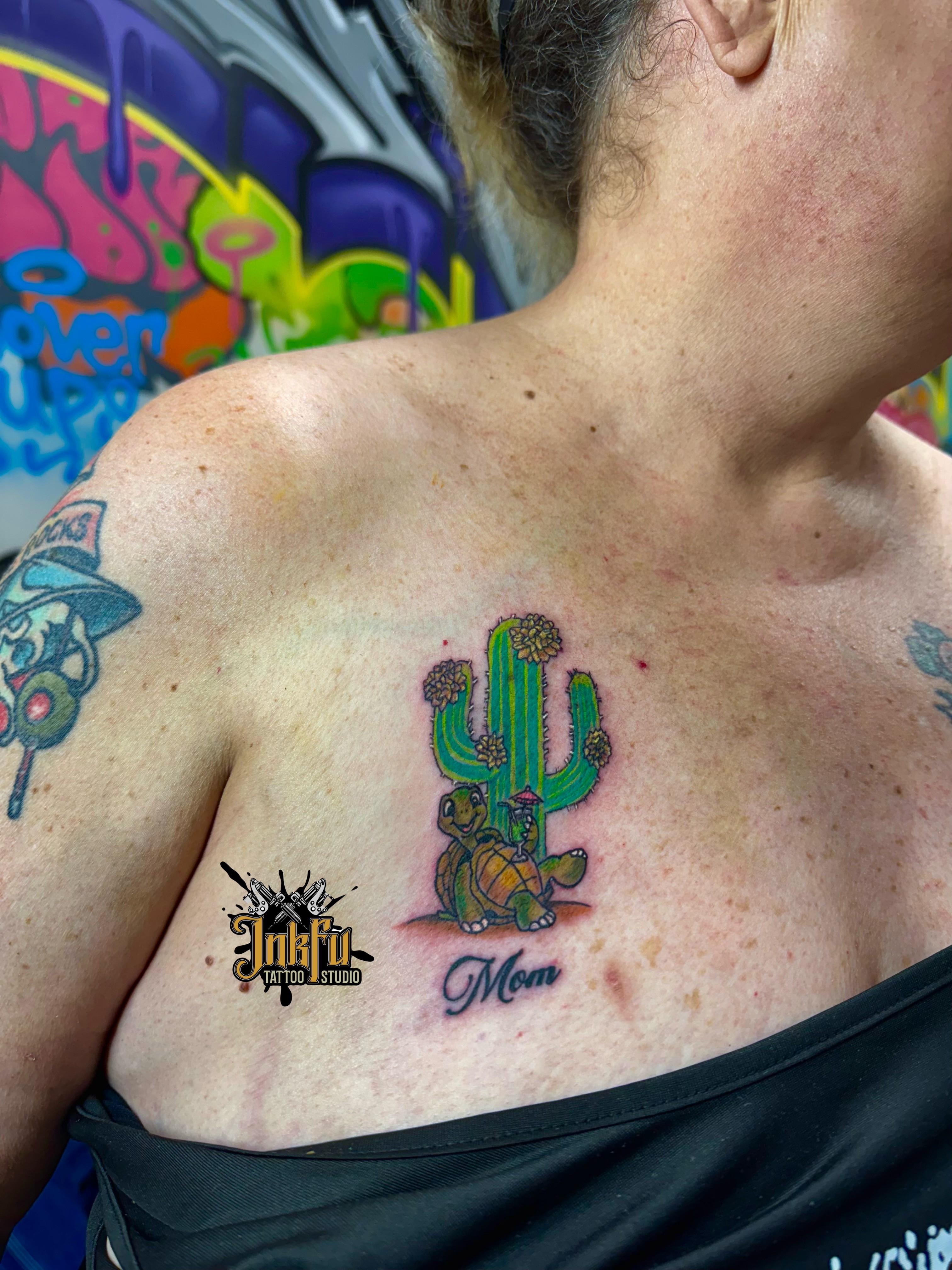 Color illustrative cactus and turtle tattoo with script text on the chest, by Meer Rich