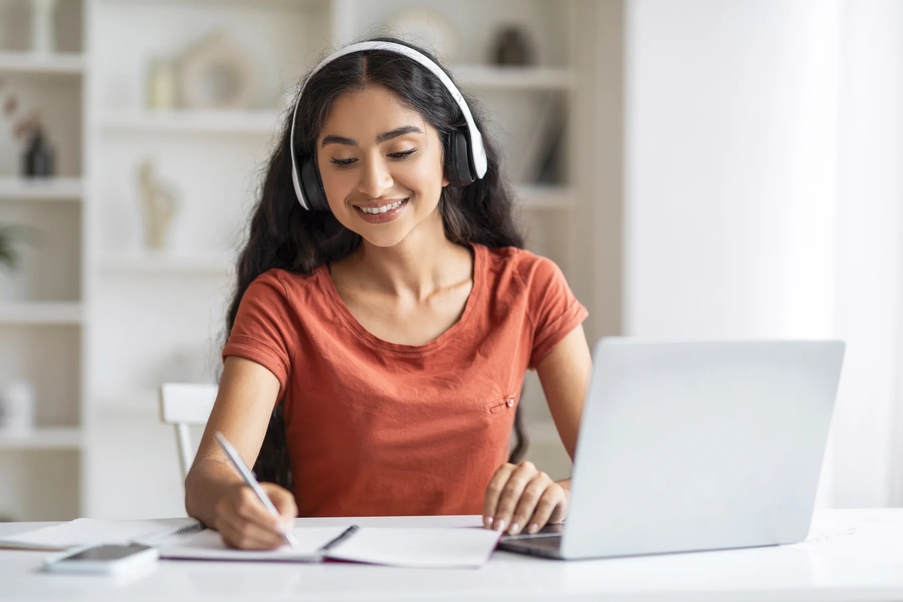 Woman Studying Online at Home with Laptop