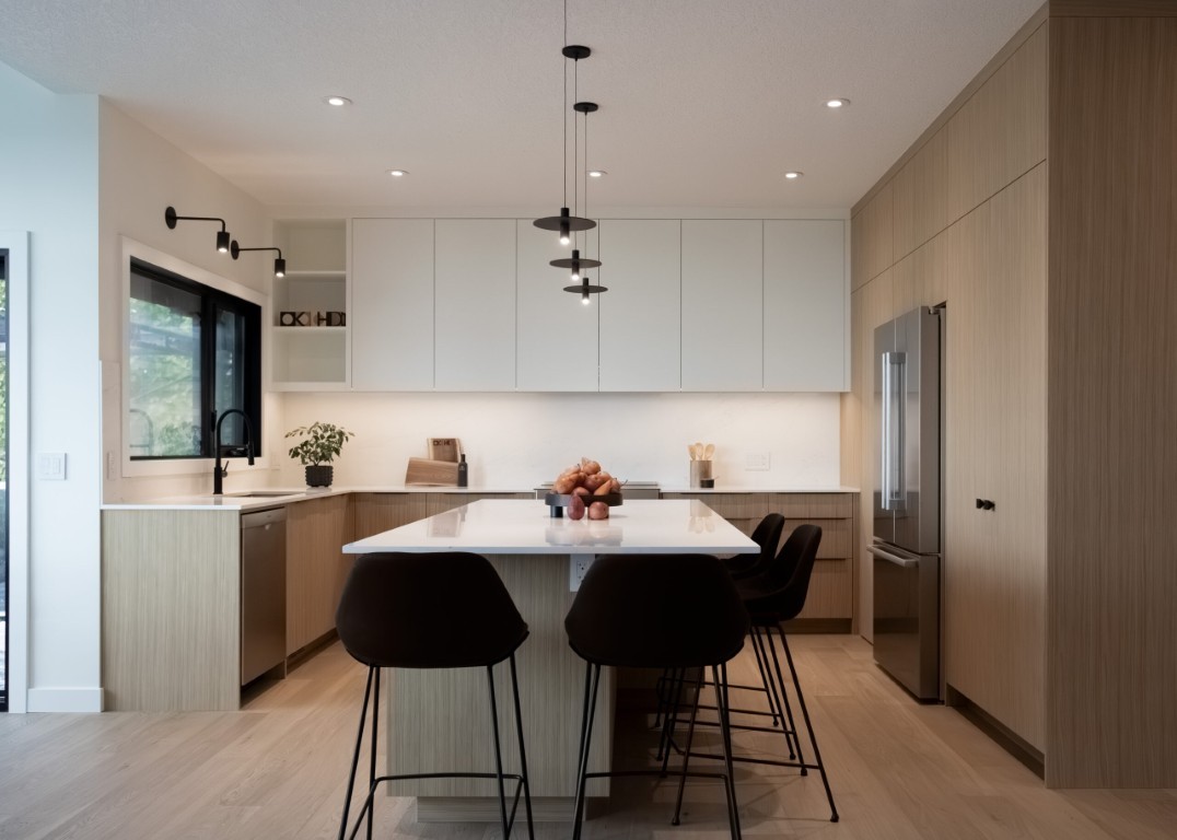 Image of Modern kitchen design with island, furniture, and layout design by KHD Homes for home renovations.