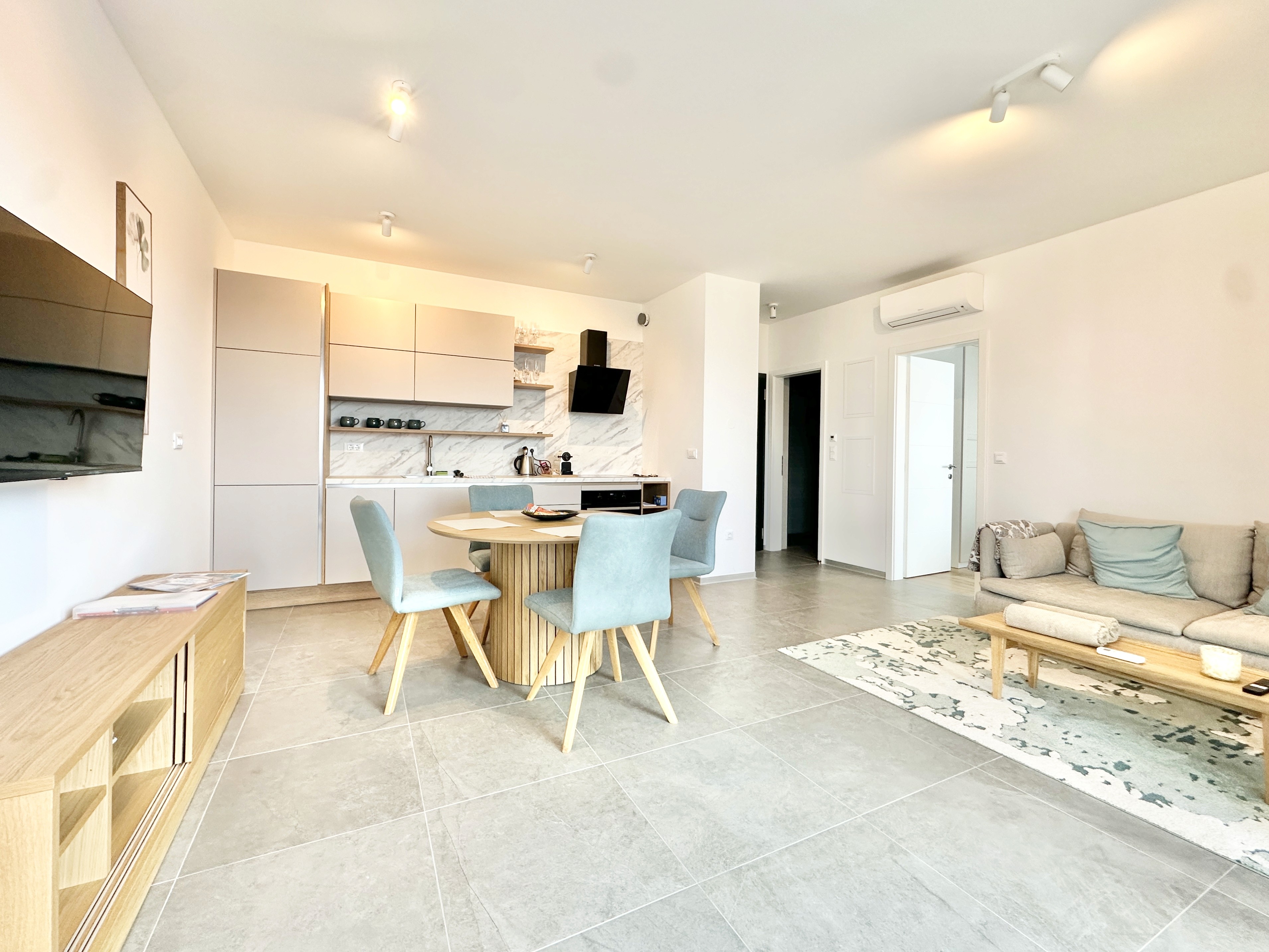 Bedroom with wall bookshelf and mountain view.