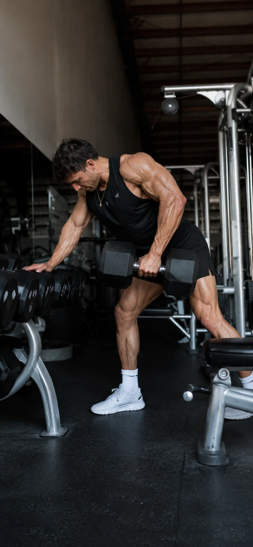 Athlete lifting dumbbells