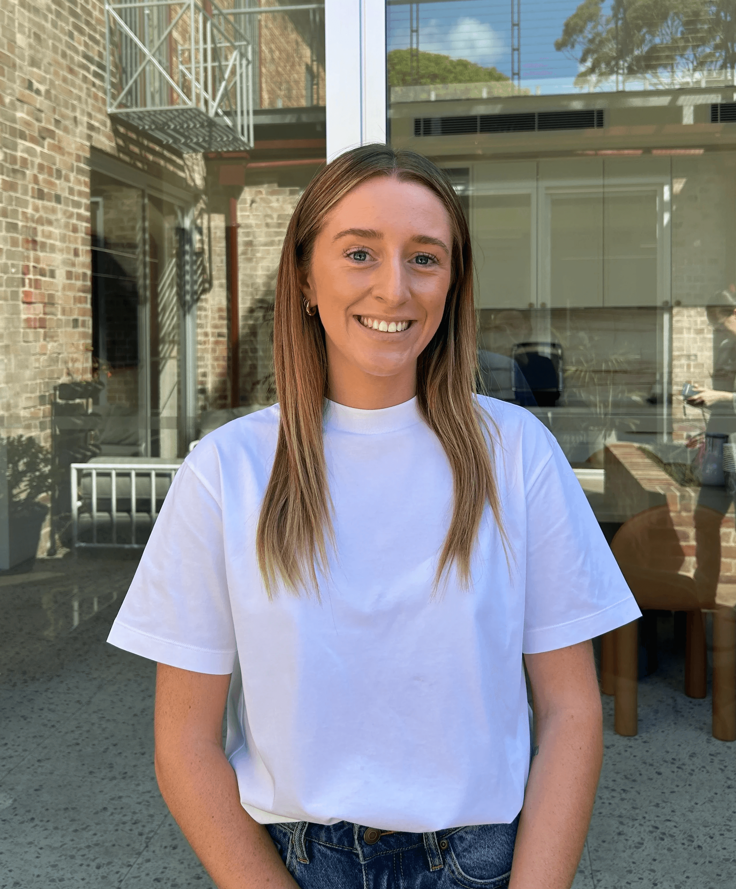 a blurry photo of a person standing in front of a wall