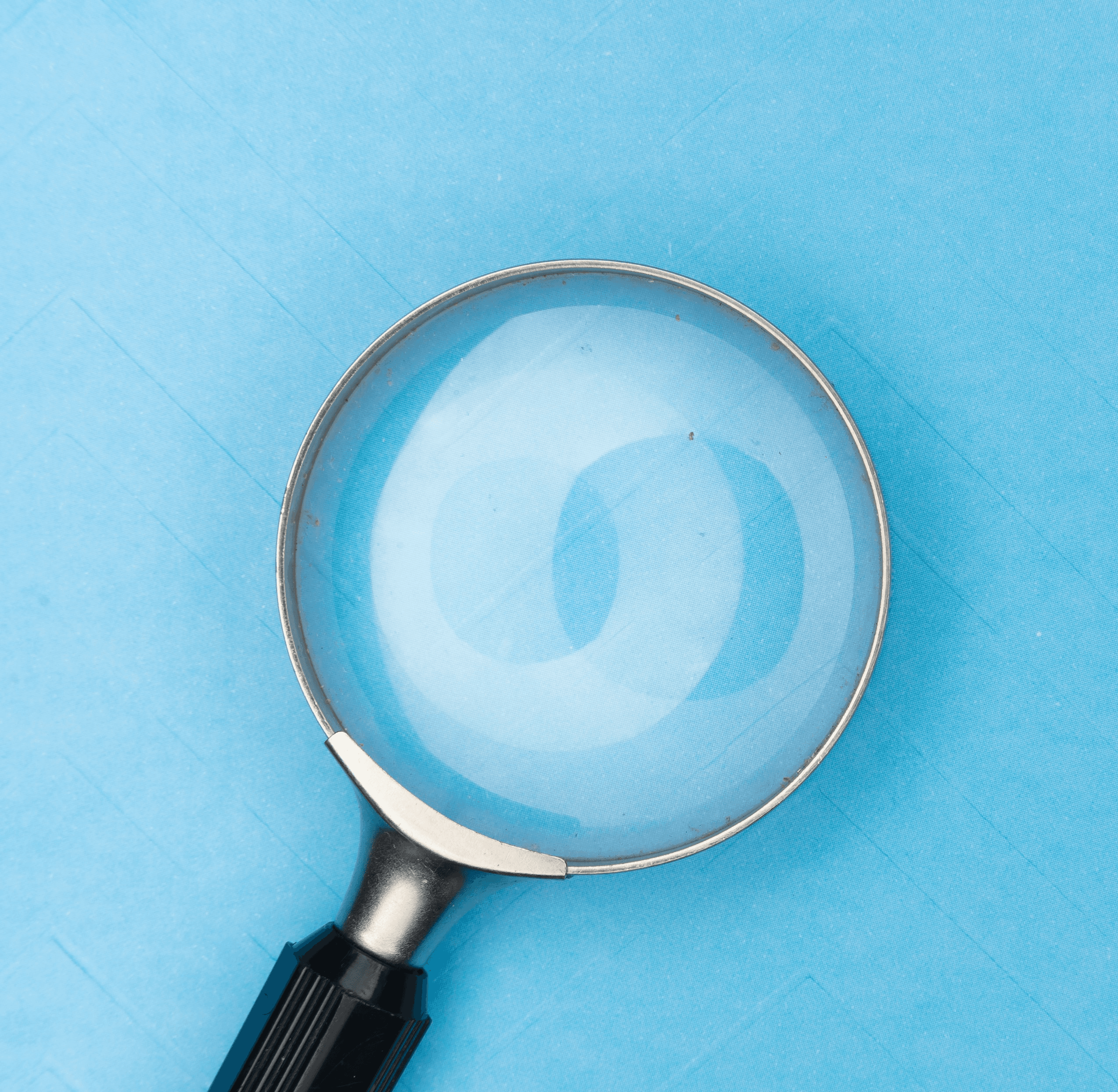 magnifying glass on white table