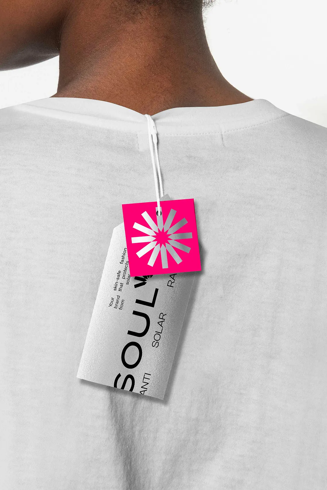 SOUL-A branded product tag attached to a white garment