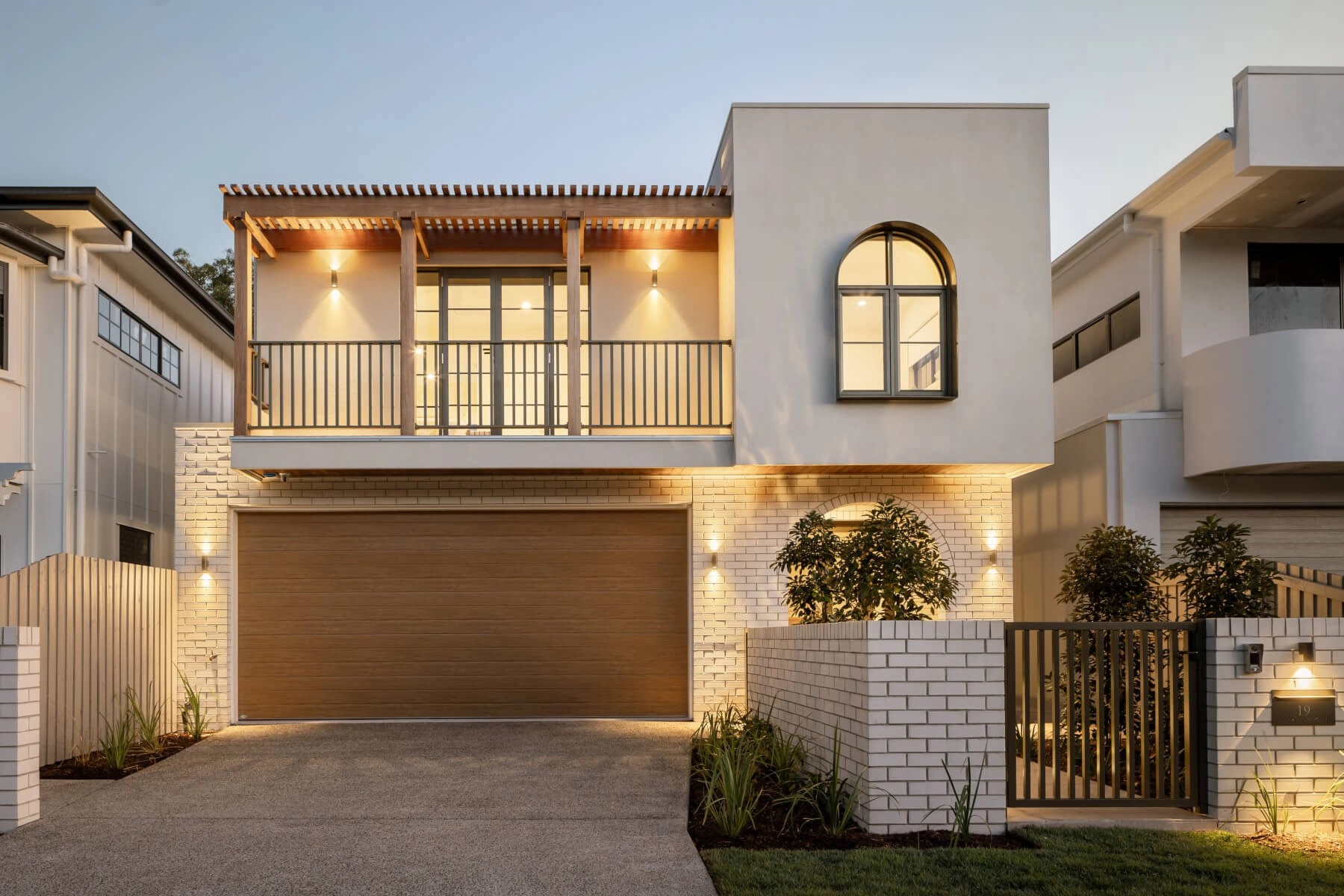 Lighting highlighting the materials used on the facade in a Brisbane home design
