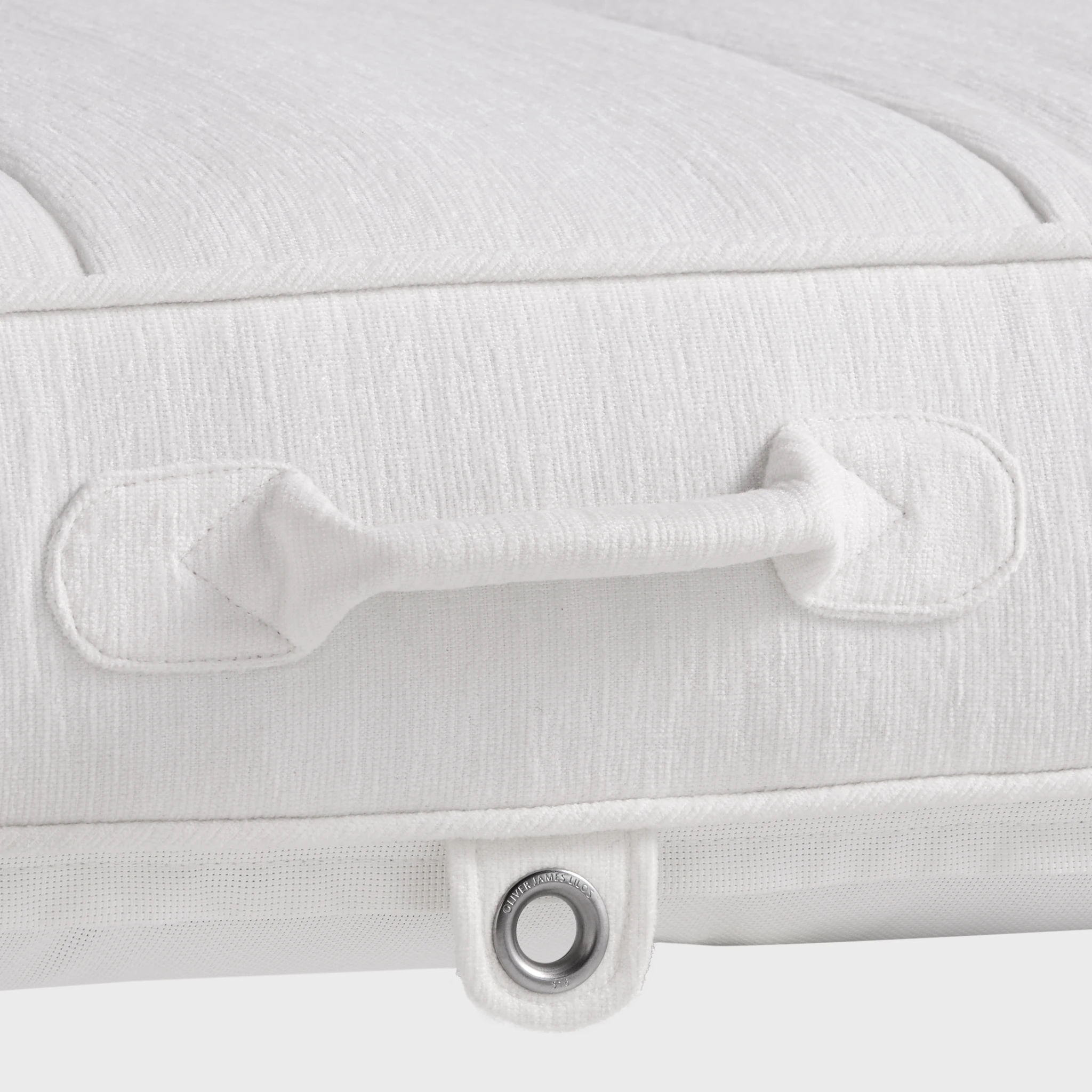 Close-up of a white luxury pool float handle with reinforced stitching and stainless steel eyelet — premium craftsmanship by Oliver James Lilos for elegant poolside functionality.
