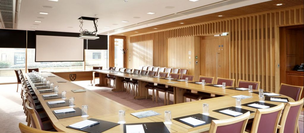 Large oval meeting room with many available places