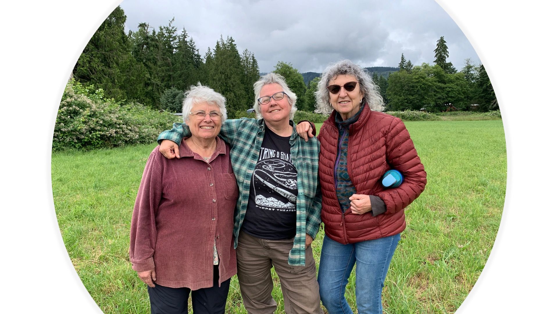 Three smiling cobuyers standing together at Rooted Northwest