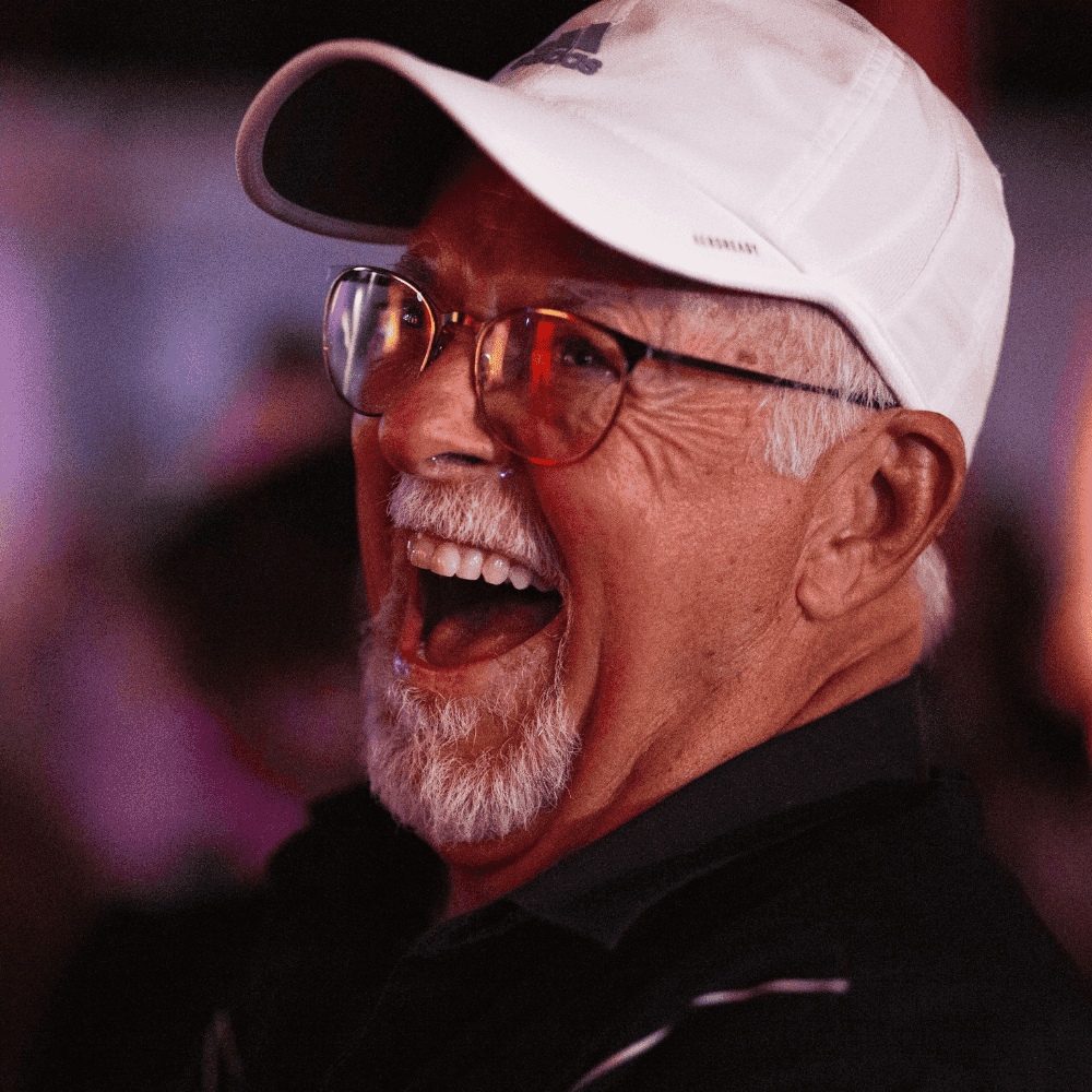 Gentleman in white hat laughing hysterically at a St Pete Standup show