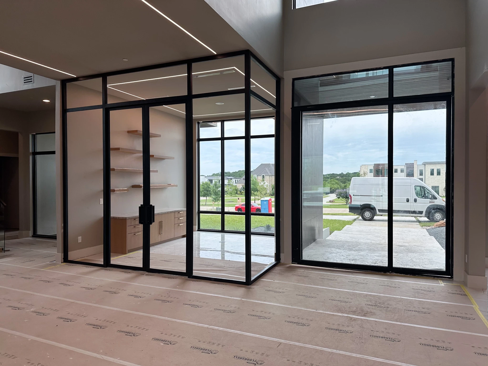 front view of a DFW Texas home with low profile iron doors by M2 Iron Doors