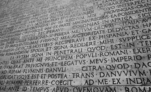 carved letters in roman wall