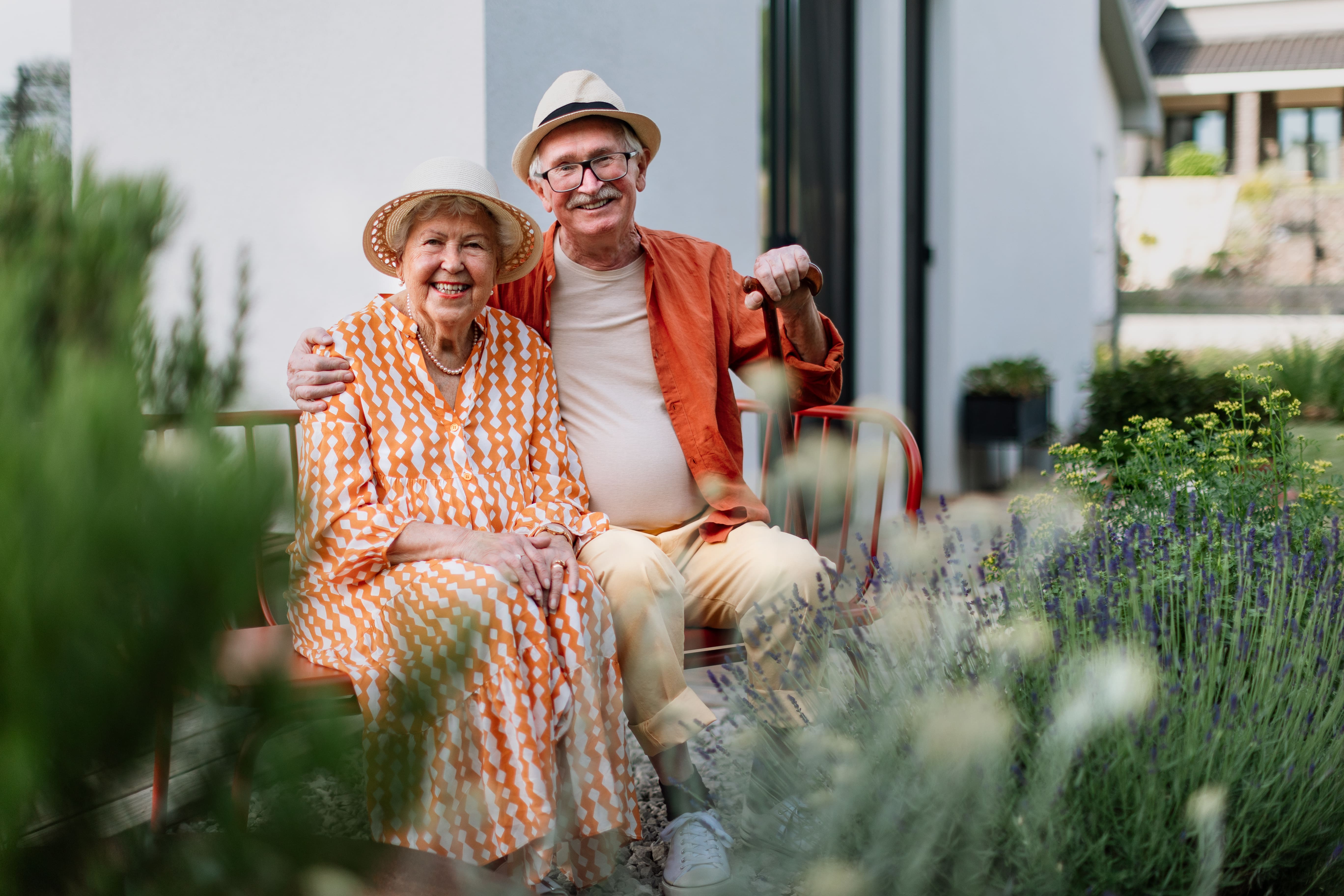 Elderly couple sitting in the garden