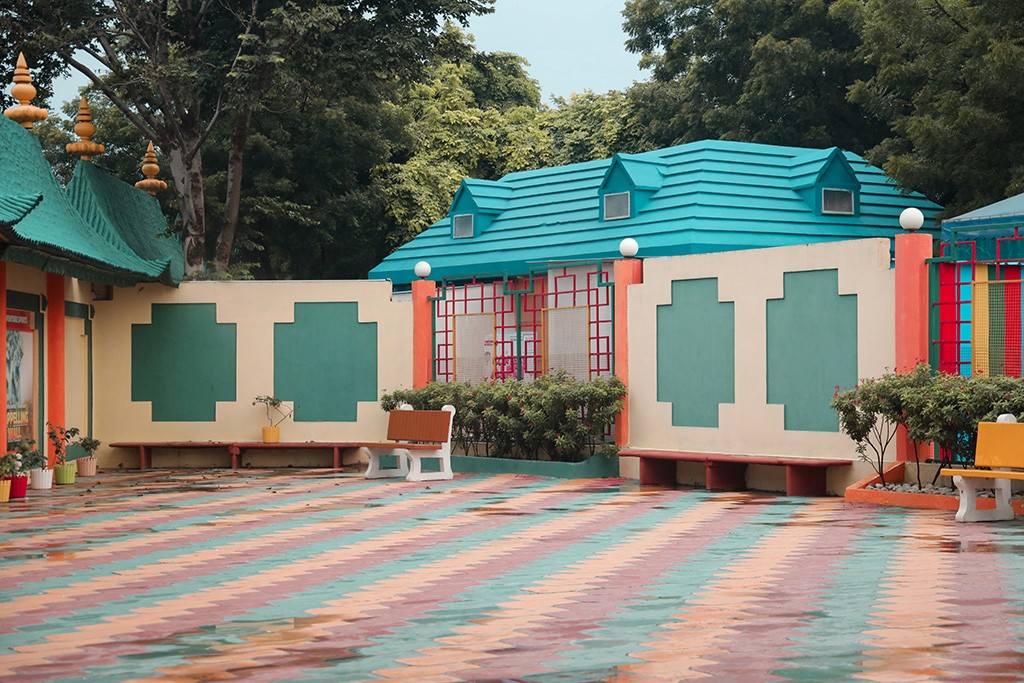 Warm modern orange living room with sofa, lamp.