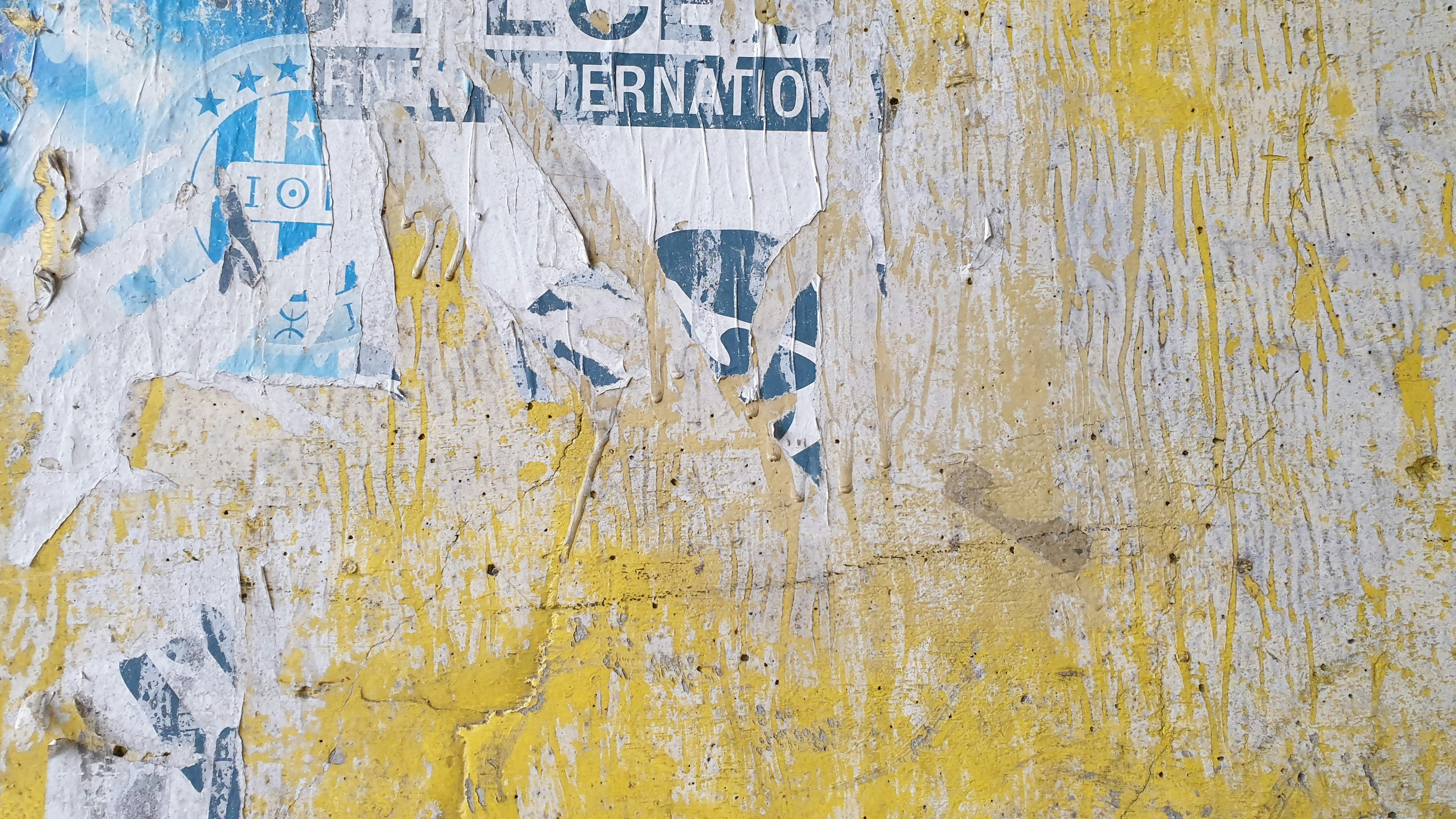 a close up of a street sign on a wall