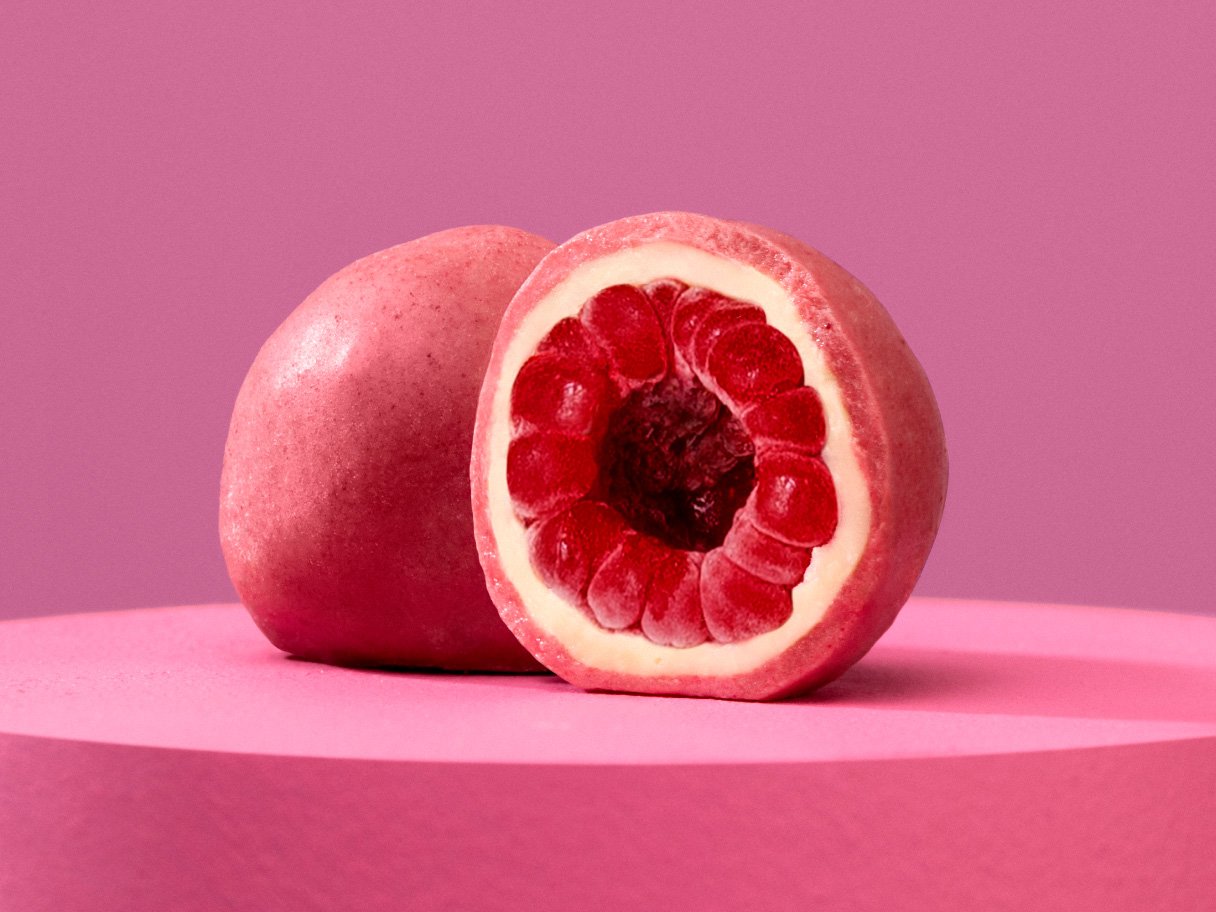 Rooftops of a coastal town with the sea in background