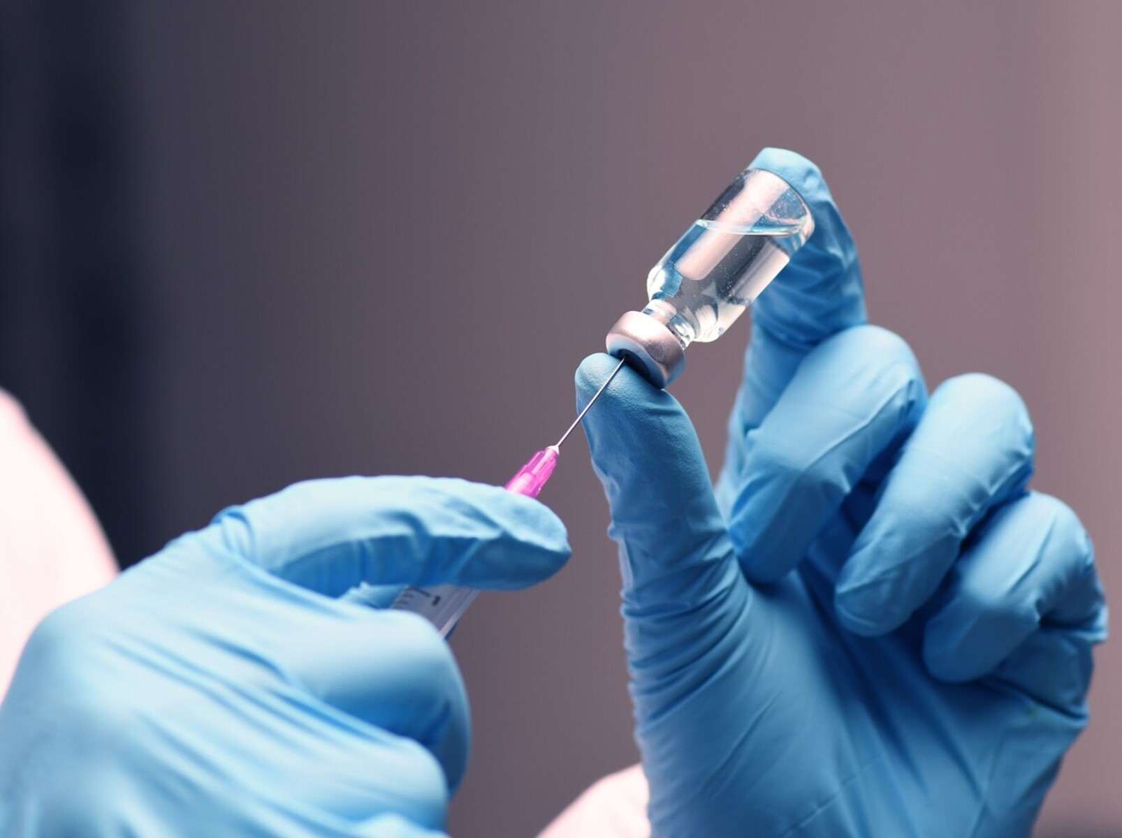 medical professional preparing a birth control shot after discussing concerns about weight gain on birth control