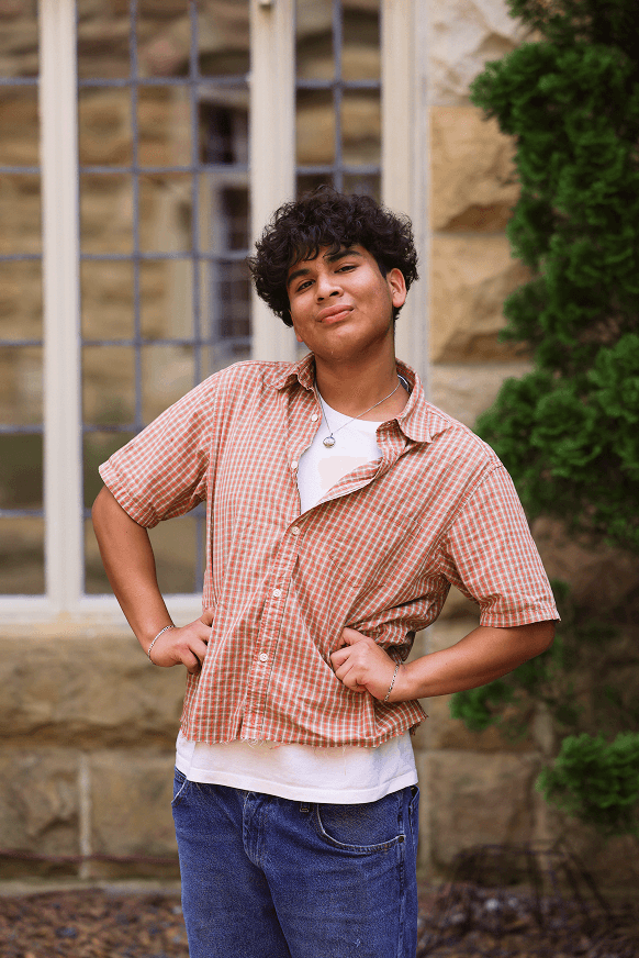 Camp College kid standing in front of Sewanee University, where camp college was hosted.
