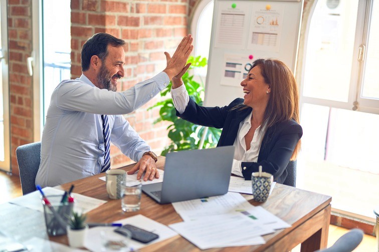 Happy employees giving a high five