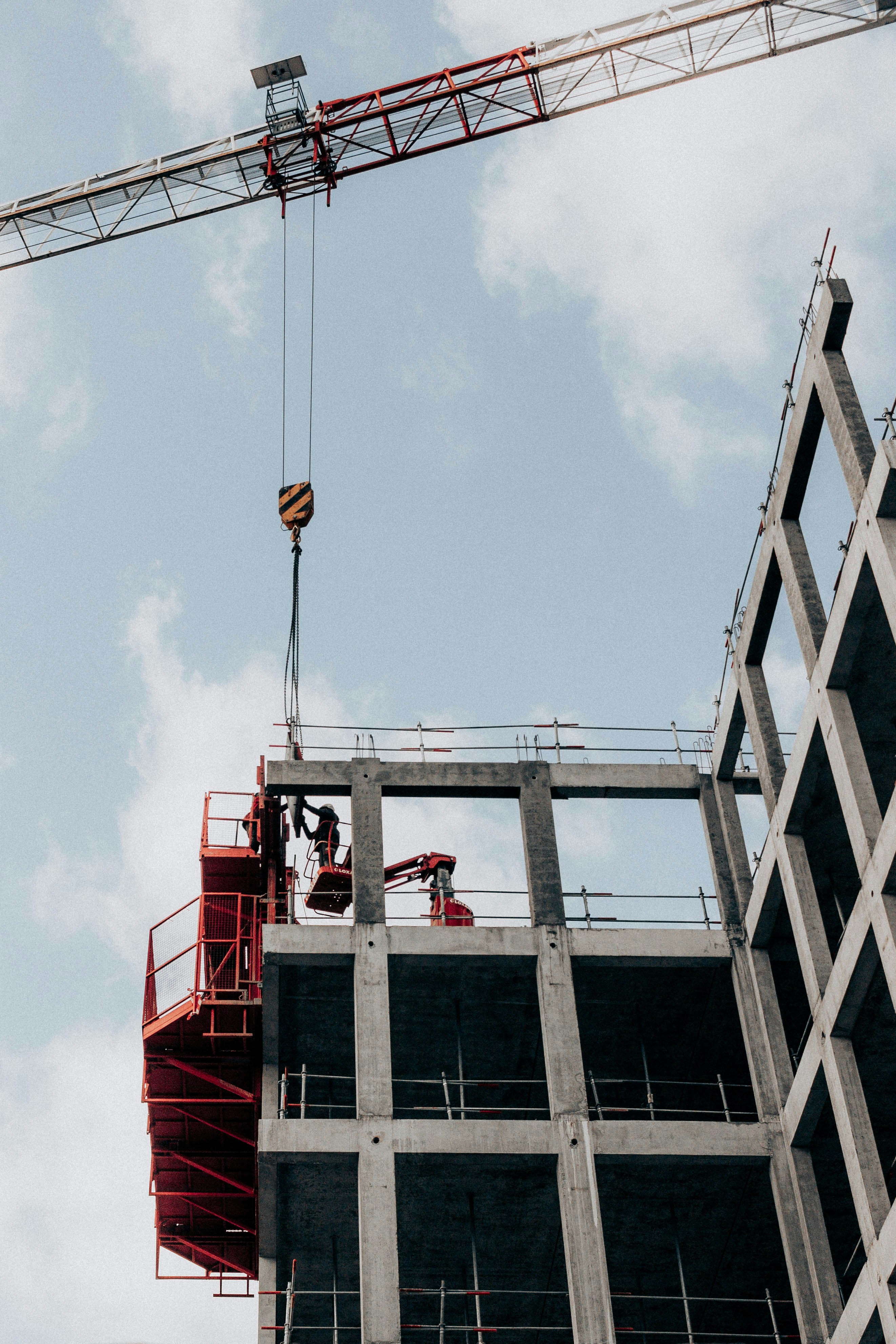 a man working on a roof with a power drill