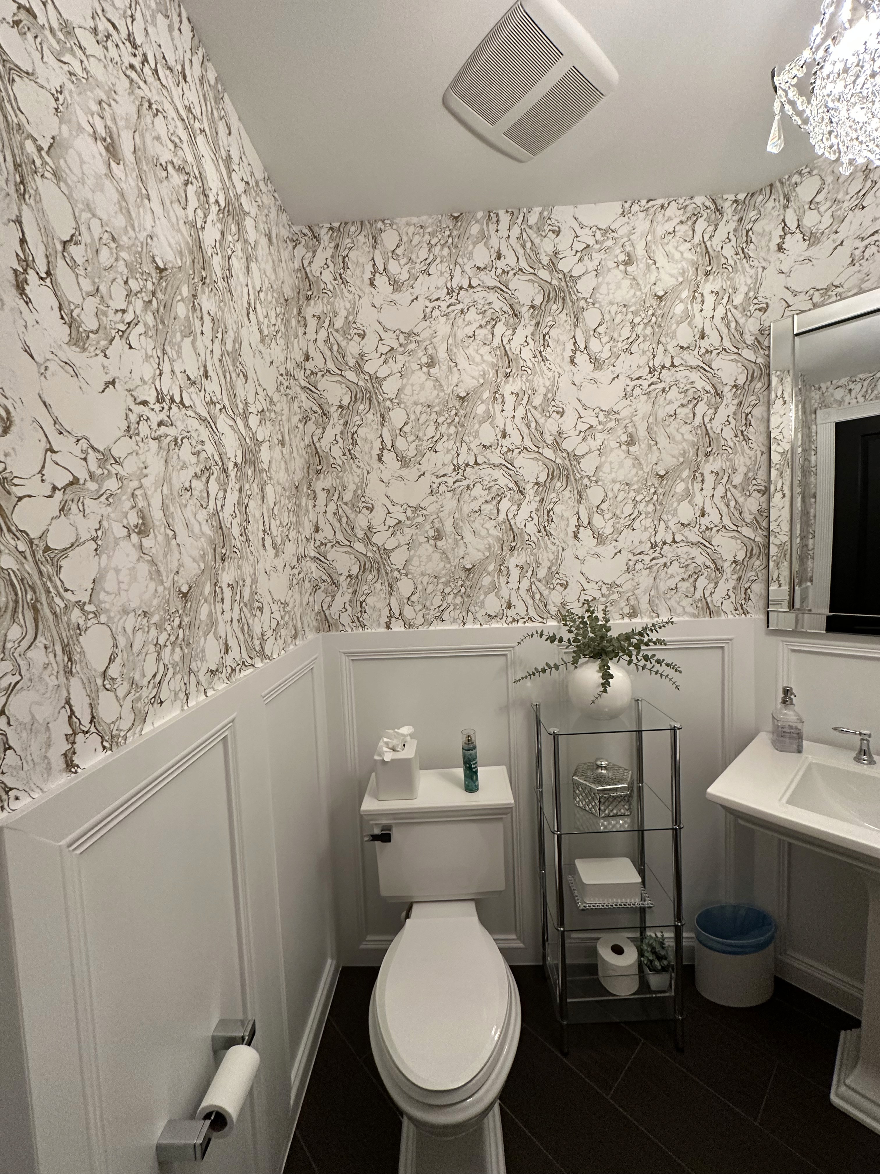 Powder bathroom wallpaper installation with patterned luxury wallcovering