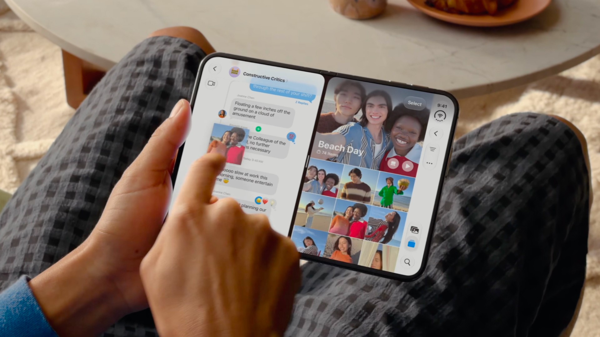 User dragging and dropping a photo from one app to another on an open iPhone Duo