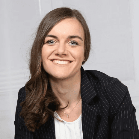woman in red cardigan smiling