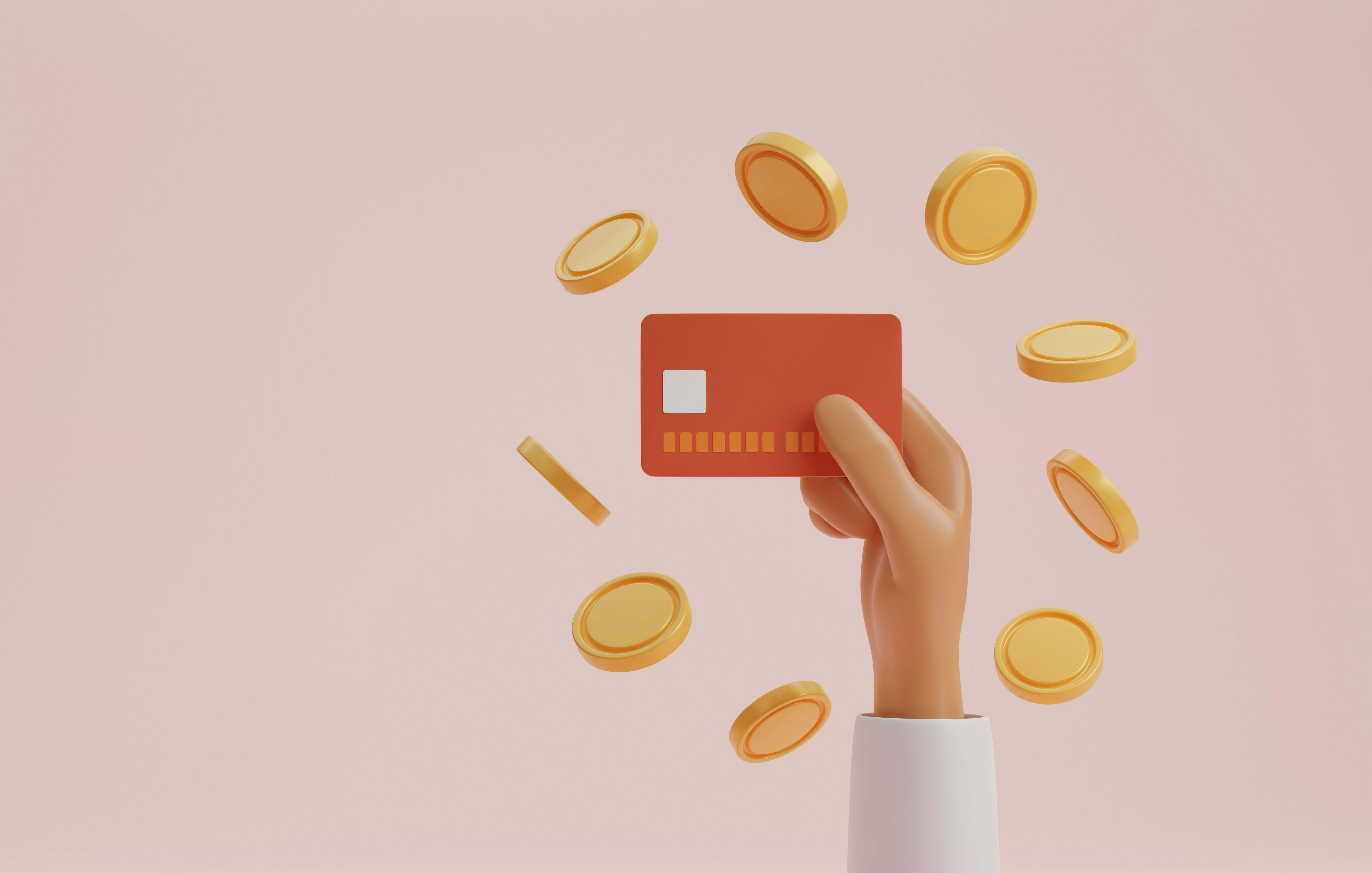 A person holds a debit card with floating coins surrounding it.