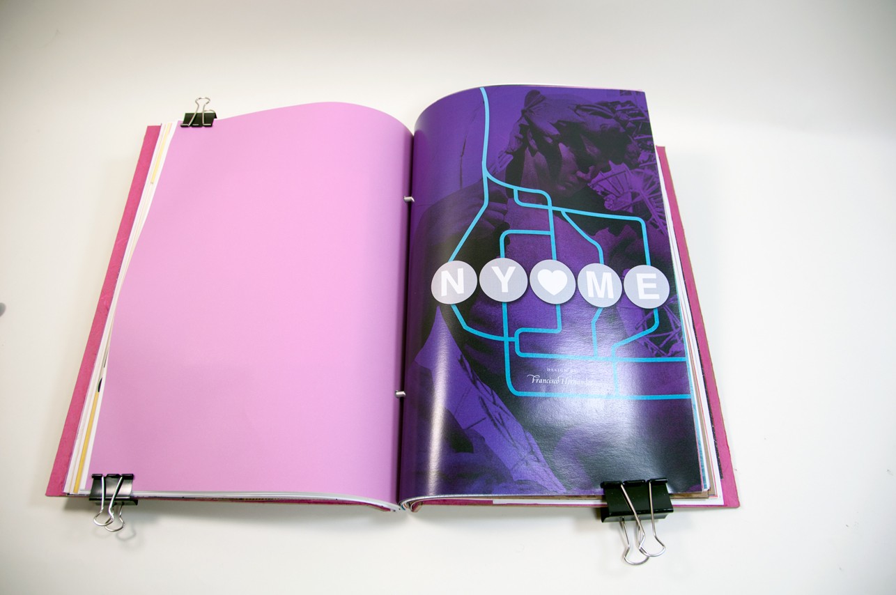 an opened book with a pink empty page on the left, and a design describing NY loves ME