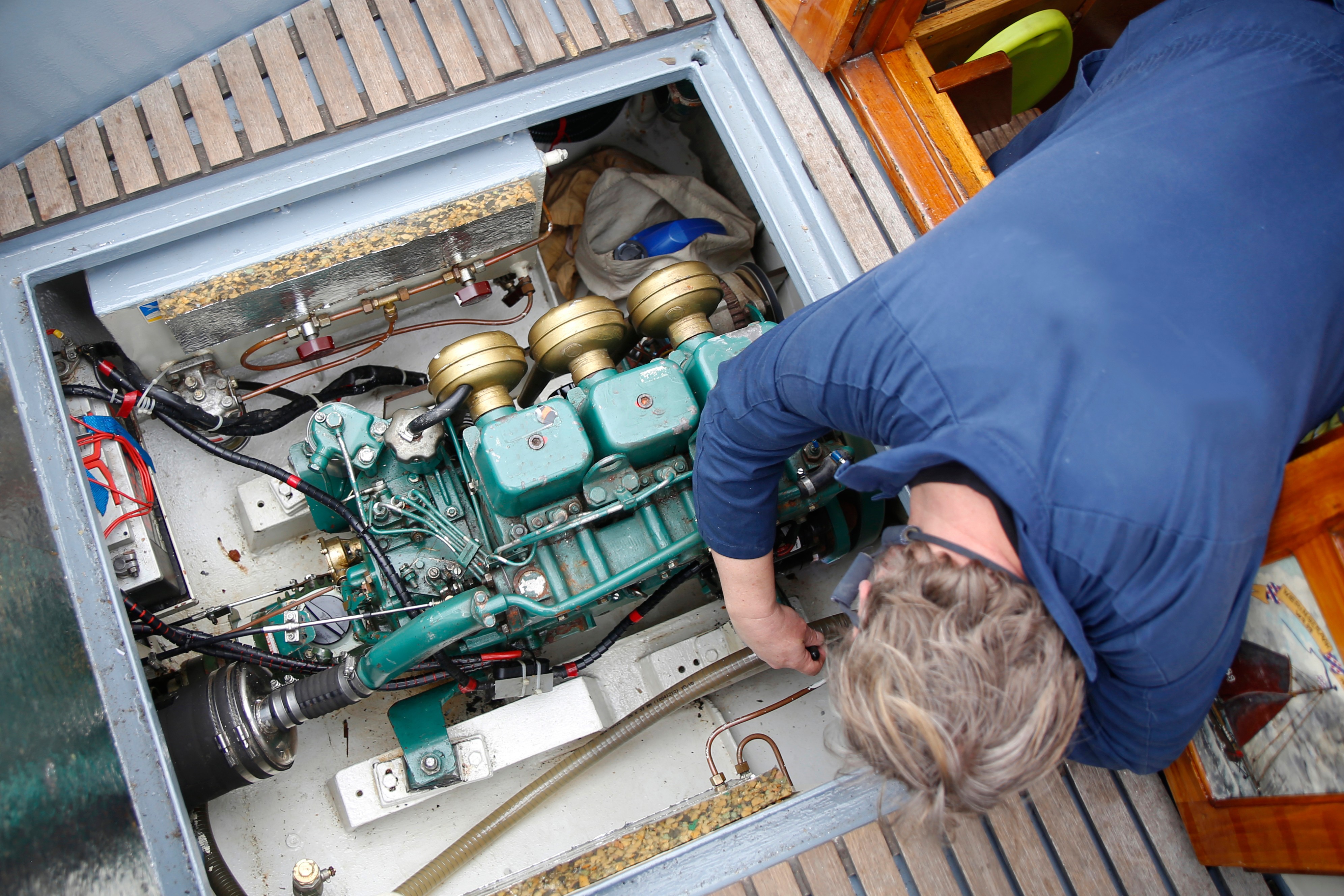 Inspection work as part of a preventive maintenance plan for marine engines.