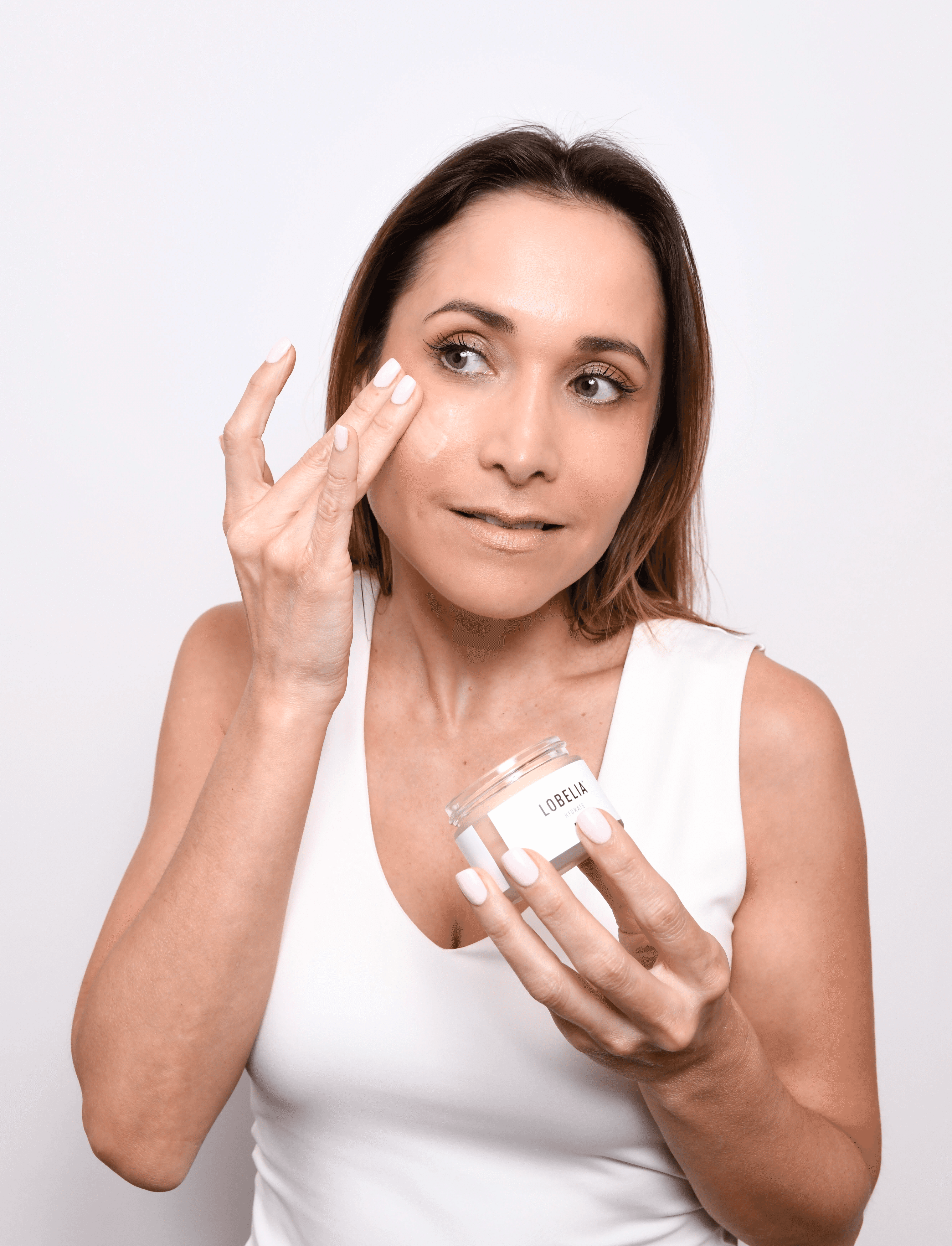 Beautiful lady with a ray of sunlight shining on her face