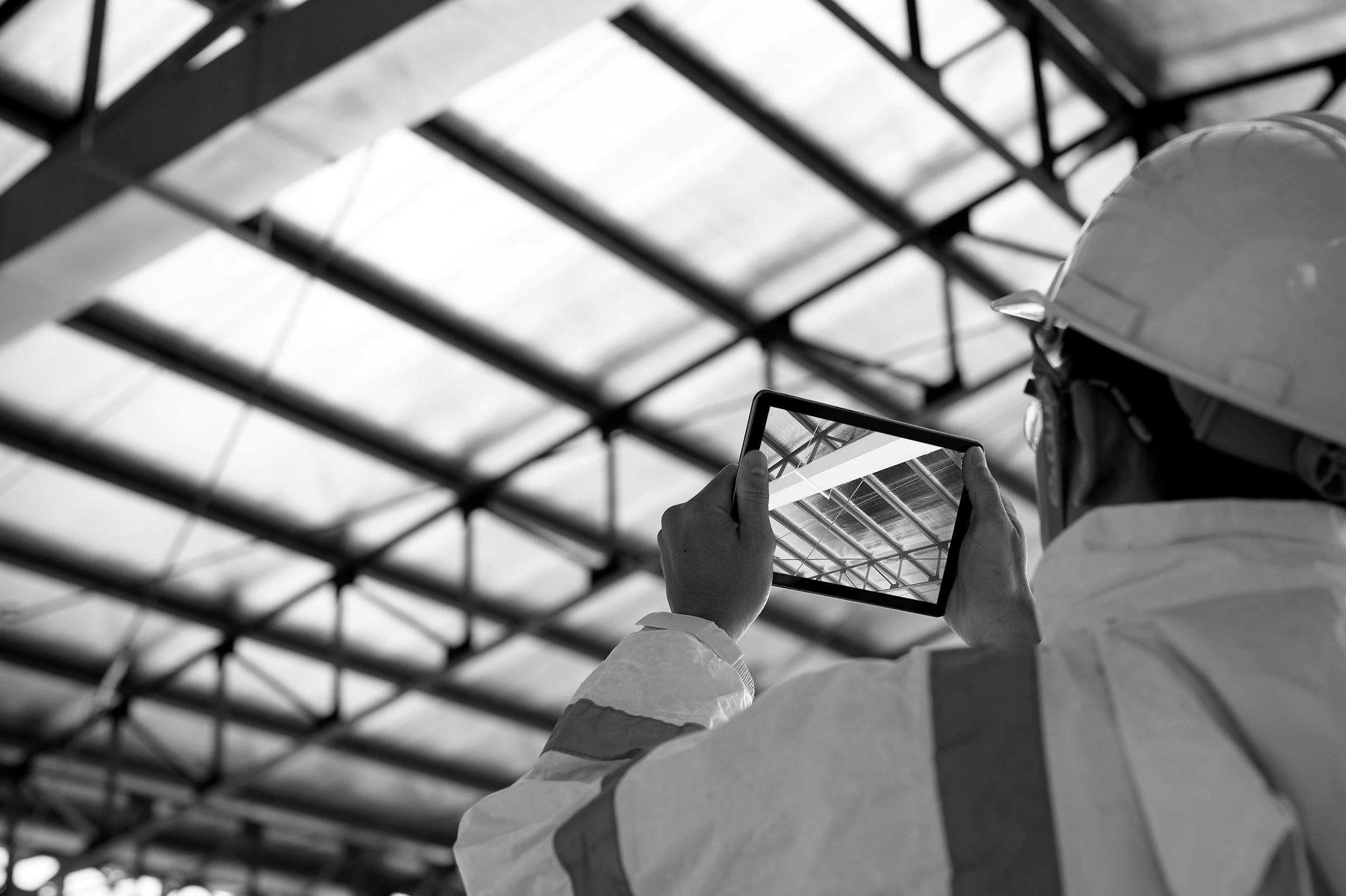 Woman holding a smartphone looking through the glass 