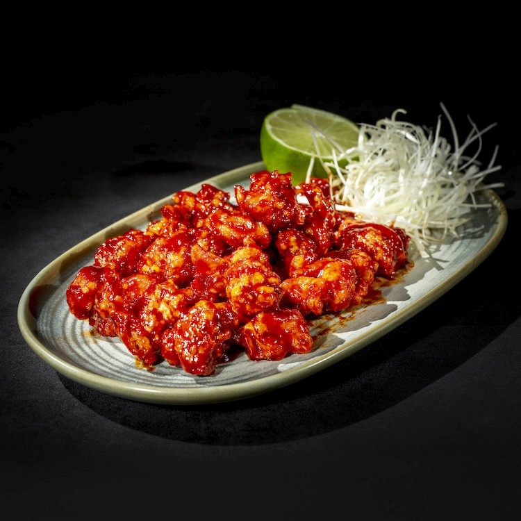 a table topped with bowls and plates of food