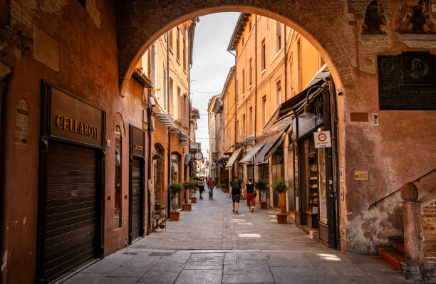 Everyday life under Bologna’s historic porticoes with locals walking